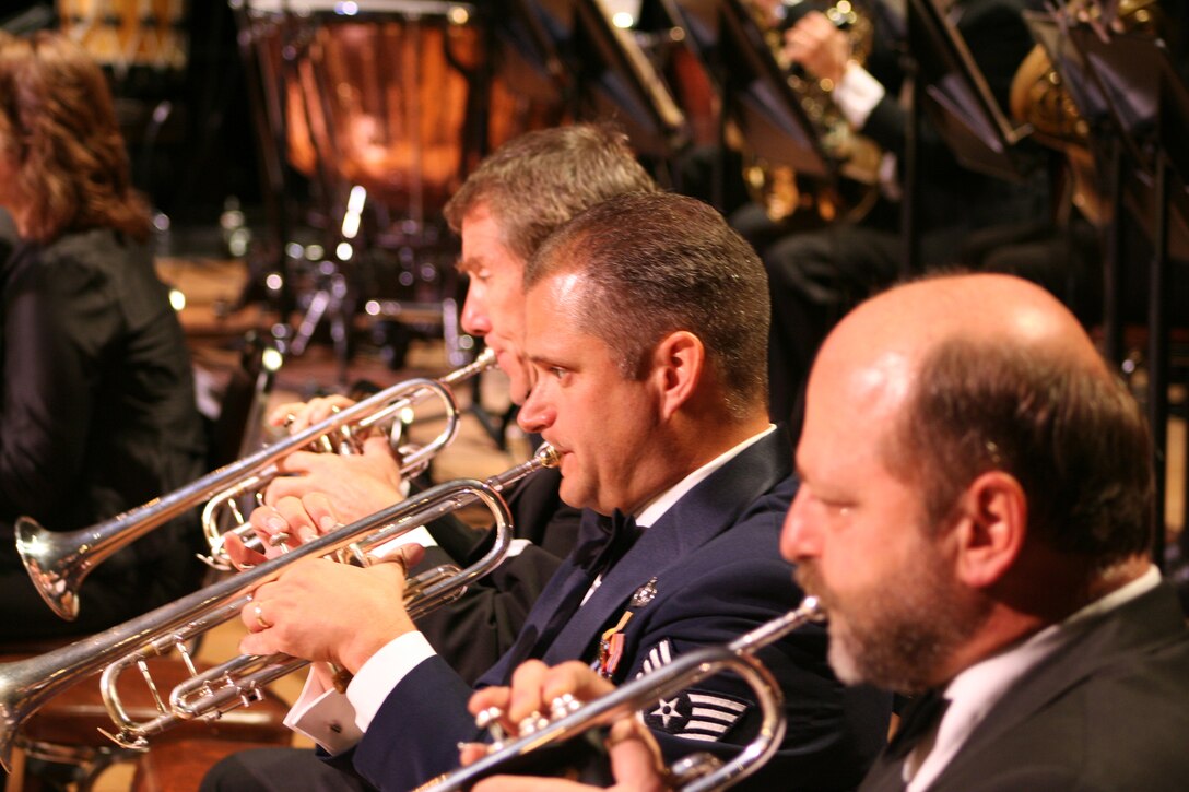 Trumpets sound as Charles Pagnard and Alan Siebert from the Dayton Philharmonic
and Staff Sgt Eric Knorr from the Air Force Band of Flight perform during Tchaikowsky's "1812 Overture."