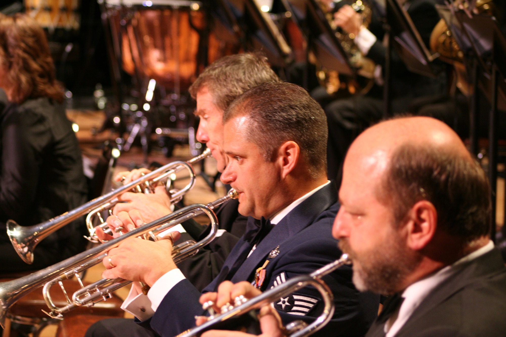 Trumpets sound as Charles Pagnard and Alan Siebert from the Dayton Philharmonic
and Staff Sgt Eric Knorr from the Air Force Band of Flight perform during Tchaikowsky's "1812 Overture."