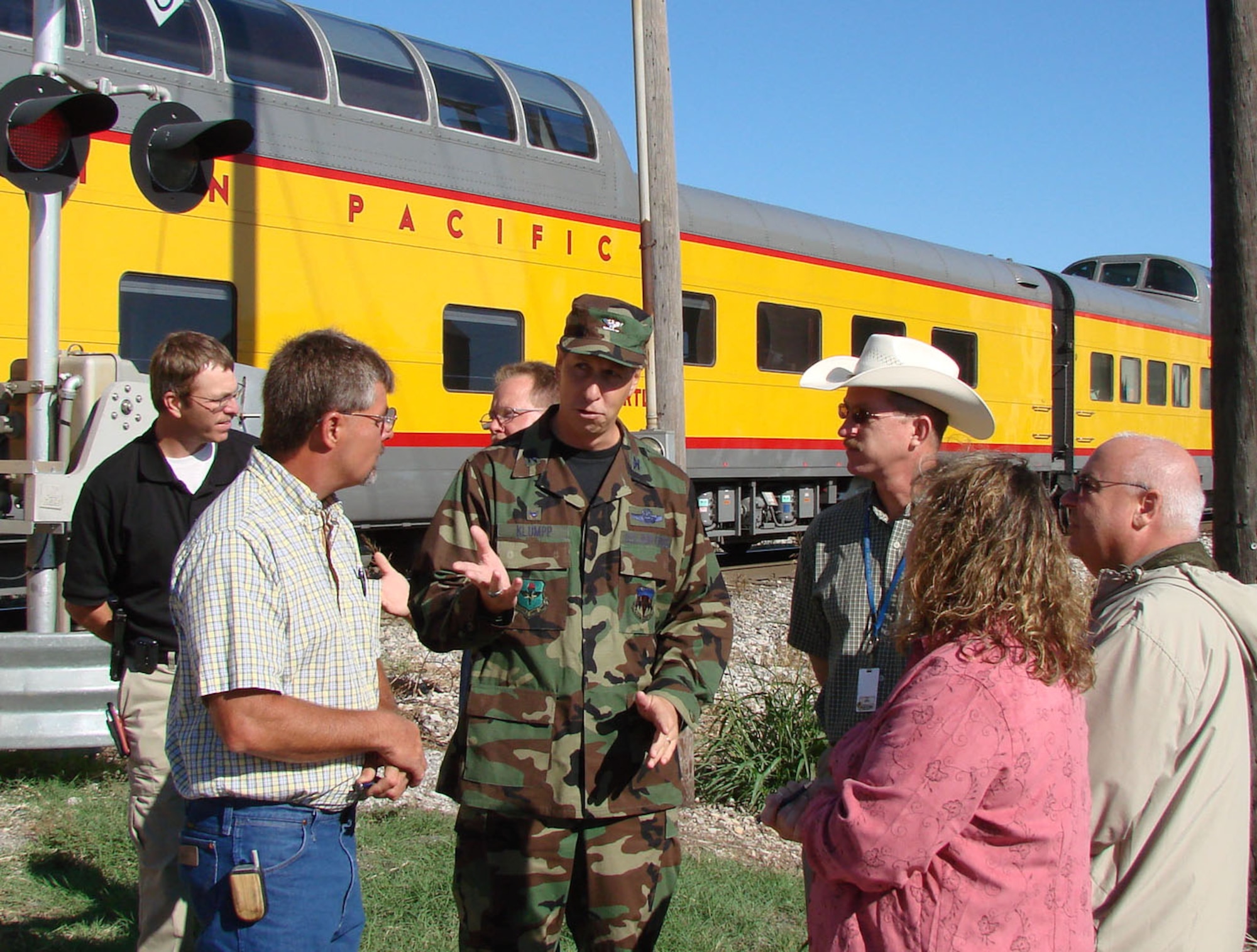 Col. Richard Klumpp, Jr., 71st Flying Training Wing commander discusses the Vance Air Force Base mission at a scheduled stop in Hennessey, Okla. Tuesday during a ride on the Union Pacific "Oklahoma Centennial Sooner Rocket." More than 80 Team Vance members took the historic trip with other military and family members from Tinker AFB and Ft. Sill in celebration of the Oklahoma Centennial and in remembrance of Sept. 11, 2001.  The train also made scheduled stops in Kingfisher and El Reno, where town officials and community members turned out to welcome the train and its special passengers.  Steam Engine 844 was the last of the steam locomotives built for the Union Pacific Railroad in 1944 and weighs more than 1,000,000 pounds.  It was the first time in more than 50 years that a steam engine operated on the Rock Island railroad tracks. (US Air Force photo/Bob Farrell)

