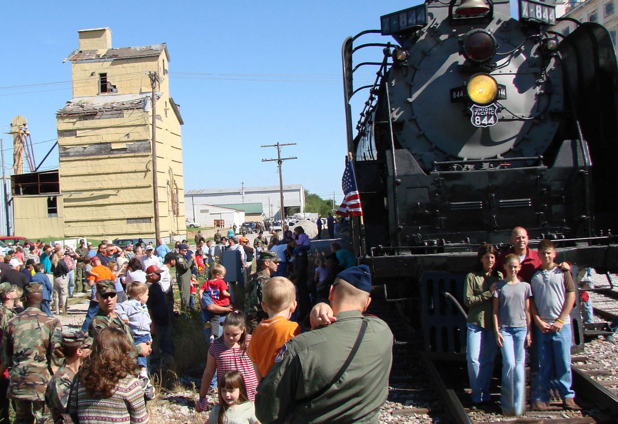More than 80 Team Vance members took a historic ride on the Union Pacific "Oklahoma Centennial Sooner Rocket" Tuesday with other military and family members from Tinker AFB and Ft. Sill in celebration of the Oklahoma Centennial and in remembrance of Sept. 11, 2001.  The train made scheduled stops in Hennessey, Kingfisher and El Reno, where town officials and community members turned out to welcome the train and its special passengers.  Steam Engine 844 was the last of the steam locomotives built for the Union Pacific Railroad in 1944 and weighs more than 1,000,000 pounds.  It was the first time in more than 50 years that a steam engine operated on the Rock Island railroad tracks. (US Air Force photo/Bob Farrell)