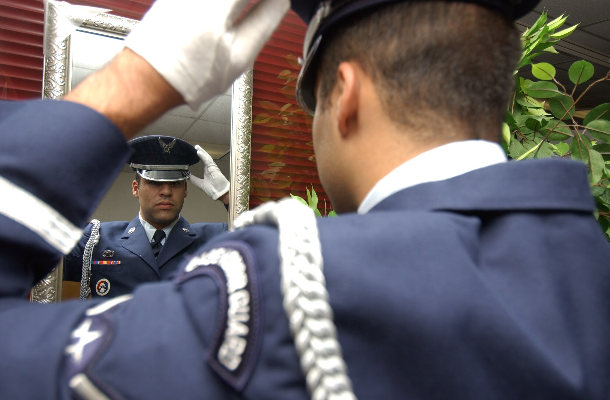 Airman Salanitri makes sure his honor guard uniform looks perfect.