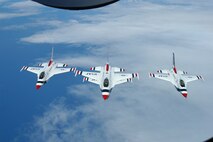 Air Force Thunderbirds fly a four-ship formation after refuleing on their way to Hawaii for Air Force Week Honolulu. A KC-135 tanker from the Hawaii AIr National Guard's 203rd refueling squadron met the thunderbirds 530 miles out from Hawaii for the final refueling on their journey from Nellis AFB. (USAF photo by Tech. Sgt. Tom Czerwinski)
