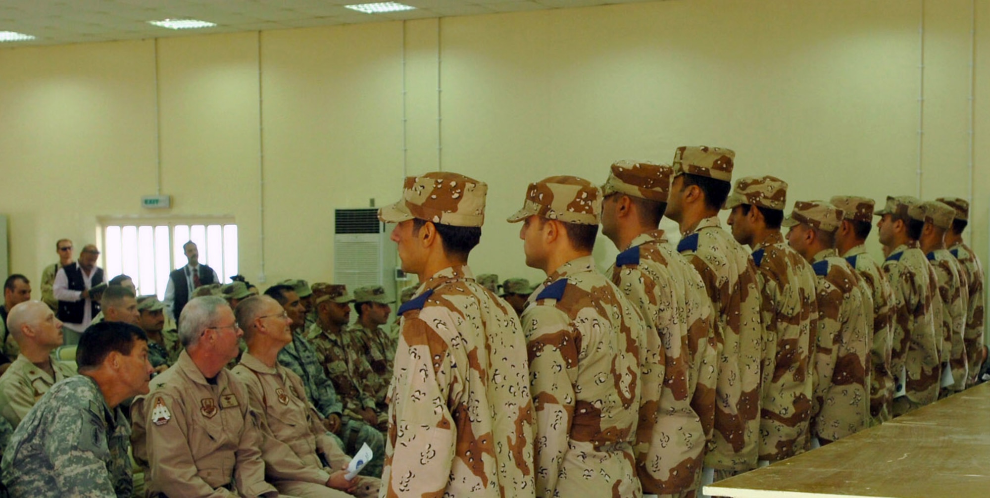 U.S. and Iraqi leaders attend a commissioning ceremony held Sept. 12 following the dedication of the new Iraqi Air Force Training School at Taji Air Base, Iraq. Eleven Iraq second lieutenants were commissioned during the ceremony.   (U.S. Air Force photo/Maj. Edwina Walton)