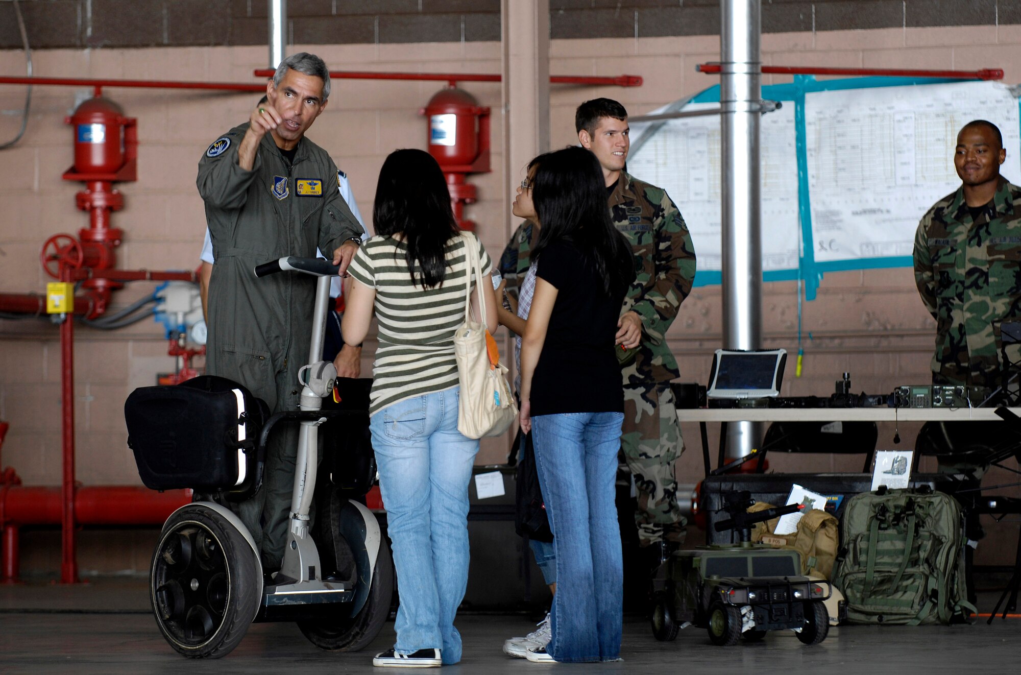 Col. J.J. Torres talks to students Sept. 13 at Hickam Air Force Base, Hawaii, during Air Force Education Day. Members of 13th Air Force hosted the day for Hawaii public school math and science students as part of Air Force Week Honolulu. Colonel Torres is 15th Airlift Wing commander. (U.S. Air Force photo/Tech. Sgt. Shane A. Cuomo) 