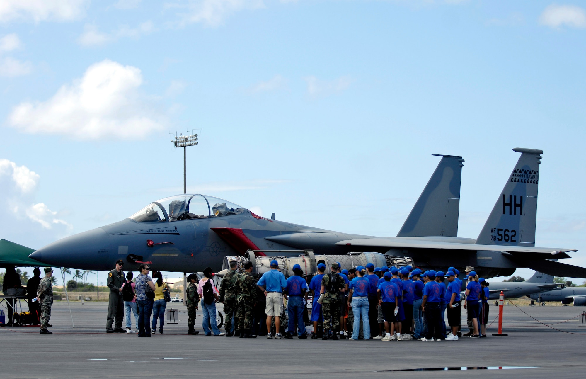 High school students are briefed on the F-15 Eagle Sept. 13 at Hickam Air Force Base, Hawaii, during Air Force Education Day. Members of 13th Air Force hosted the day for Hawaii public school math and science students as part of Air Force Week Honolulu. (U.S. Air Force photo/Tech. Sgt. Shane A. Cuomo) 