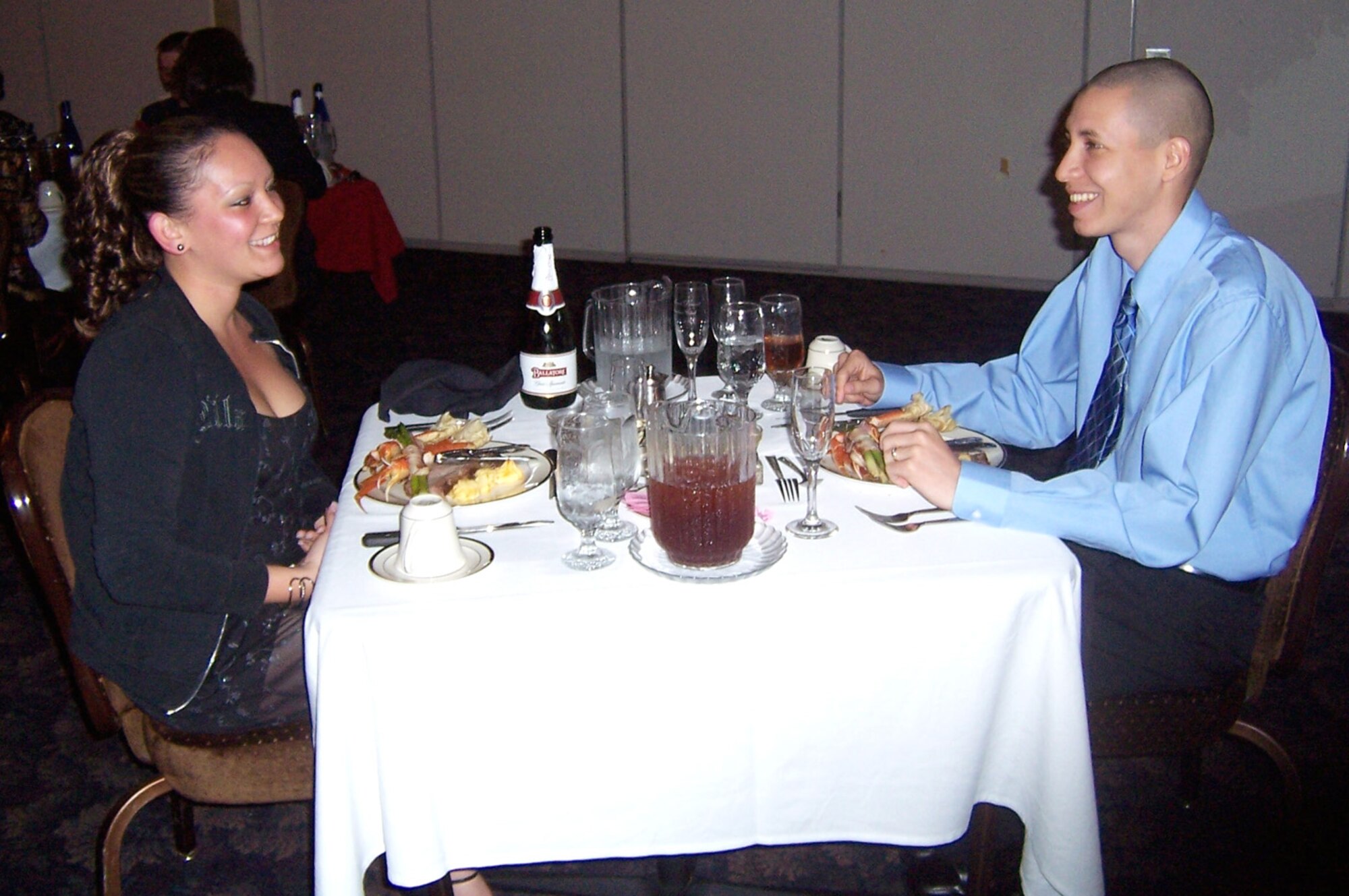 Newlyweds Senior Airman Silvestre and Shantel Gonzales, 14th Operational Support Squadron, enjoy dinner at the Columbus Club during the Club's Sweetheart Gourmet Dinner Wednesday night. The Gonzales' were married earlier Wednesday. (U.S. Air Force photo by Sonic Johnson)
