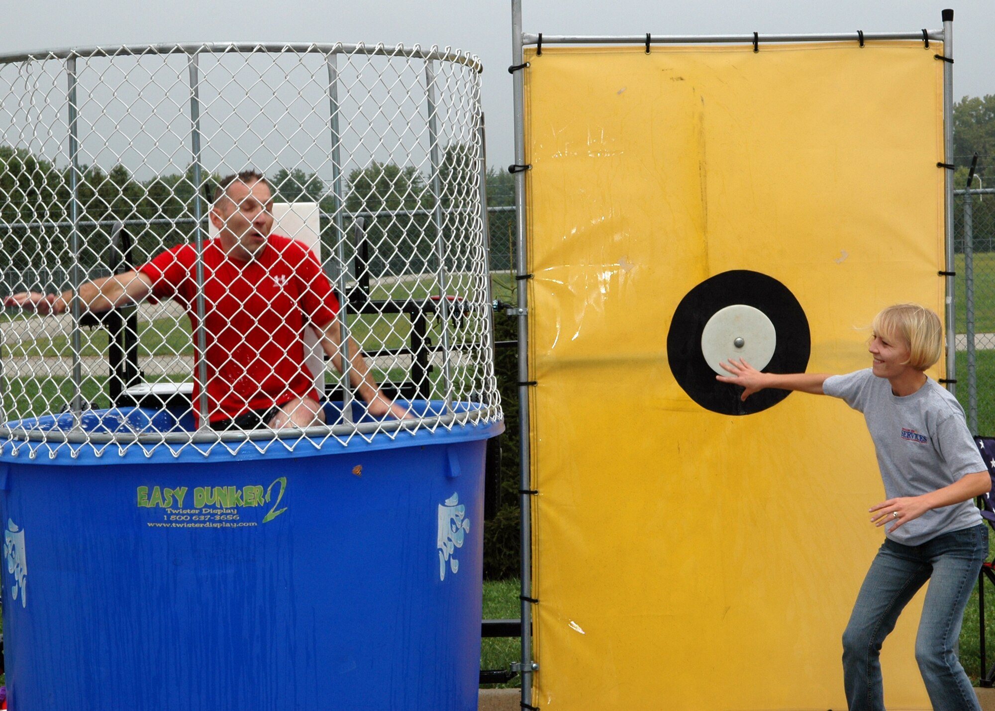 GRISSOM AIR RESERVE BASE, Ind., -- Maj. Mike Polomchak, 434th Maintenance Operations Flight commander, takes a plunge after being ambushed by Master Sgt. Cynthia Webb, 434th Services Flight. (U.S. Air Force photo/Senior Airman Chris Bolen)
