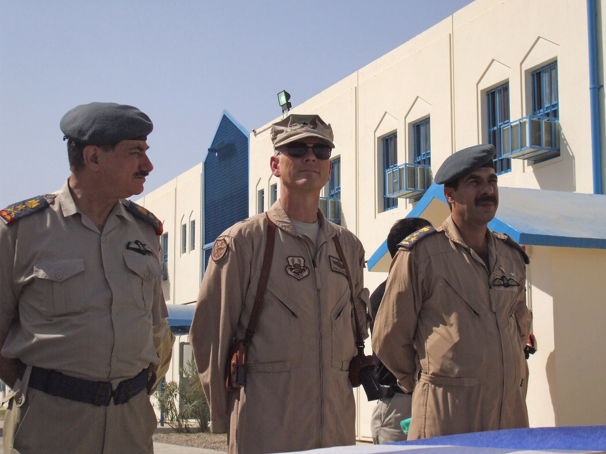 Lt. Gen. Kamal Brazanjay (left) and Brig. General Robert R. Allardice join the commandant of the new Iraqi Air Force Training School for a dedication ceremony held Sept. 12at Taji Air Base, Iraq. General Brazanjay, is the commander of the Iraqi Air Force and General Allardice is the commander of the Coalition Air Force Transition Team. (U.S. Air Force photo/Maj. Edwina Walton)