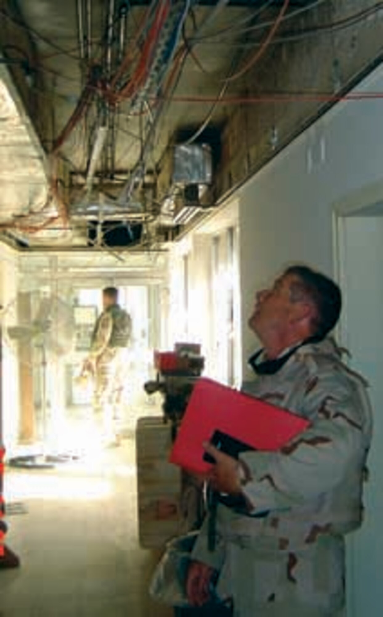 Hal Steinman, electronic engineer with the 38th Engineering Installation Group, inspects communications requirements while deployed to Southwest Asia. (Air Force photo)