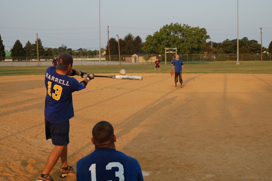 Preston Harrell, 436th Aerial Port Squadron swings and connects, sending the ball into left field Sept. 7 in the Dover All-Night Softball Tournament. Harrell and the Porters won the tournament, sponsored by the First Sergeants’ Council. (U.S. Air Force photo/Airman Shen-Chia Chu)
