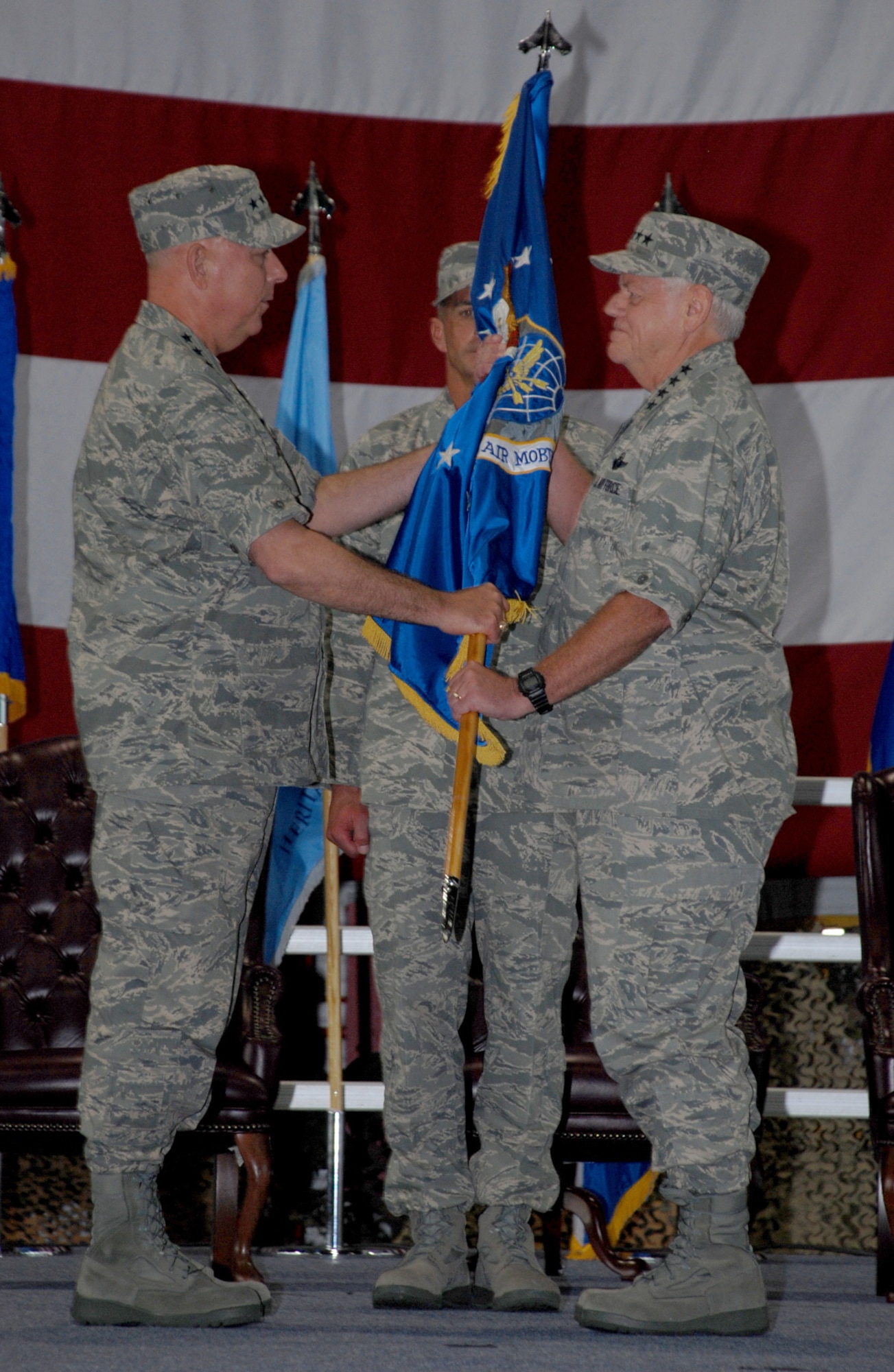 SCOTT AIR FORCE BASE,  Ill. -- Gen. T.Michael Mosley, Air Force Chief of Staff, passes the Air Mobility Command guideon to Gen. Arthur Lichte, new AMC commander, at the AMC change of ceremony Sept 7. (Photo by Airman 1st Class Jessica Lockoski)