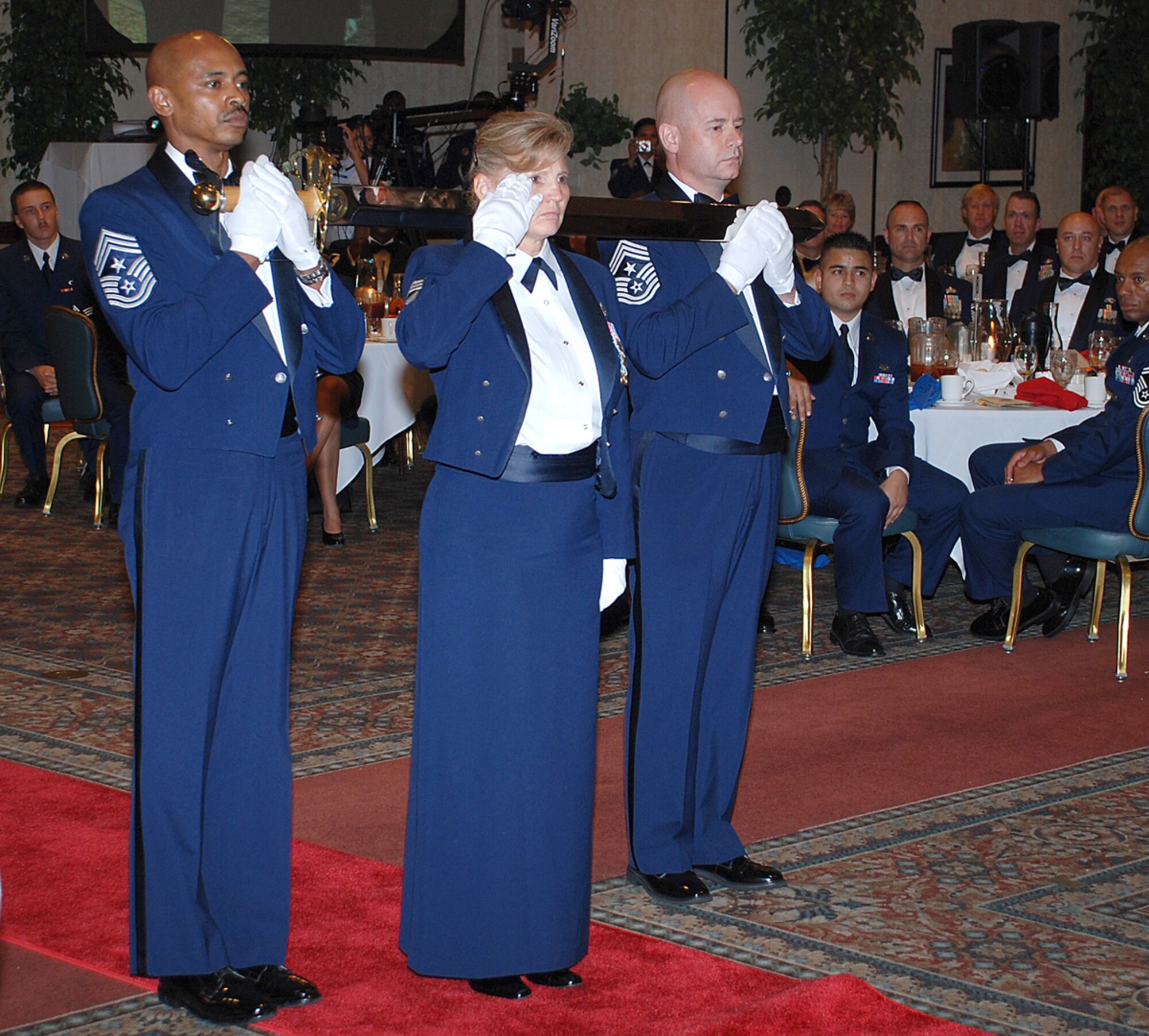 SCOTT AIR FORCE BASE, Ill. -- Chief Master Sgt. Peggy Savage, 22nd Air Refueling Wing command chief, renders a salute to Gen. Duncan McNabb, Air Mobility Command commander, during his Order of the Sword ceremony Sept. 6. Chief Savage participated as the guardian of the sword in the award presented to the general. The Order of the Sword is the highest honor that a noncommissioned officer can bestow upon an individual. (Photo by Airman 1st Class Jessica Lockoski)