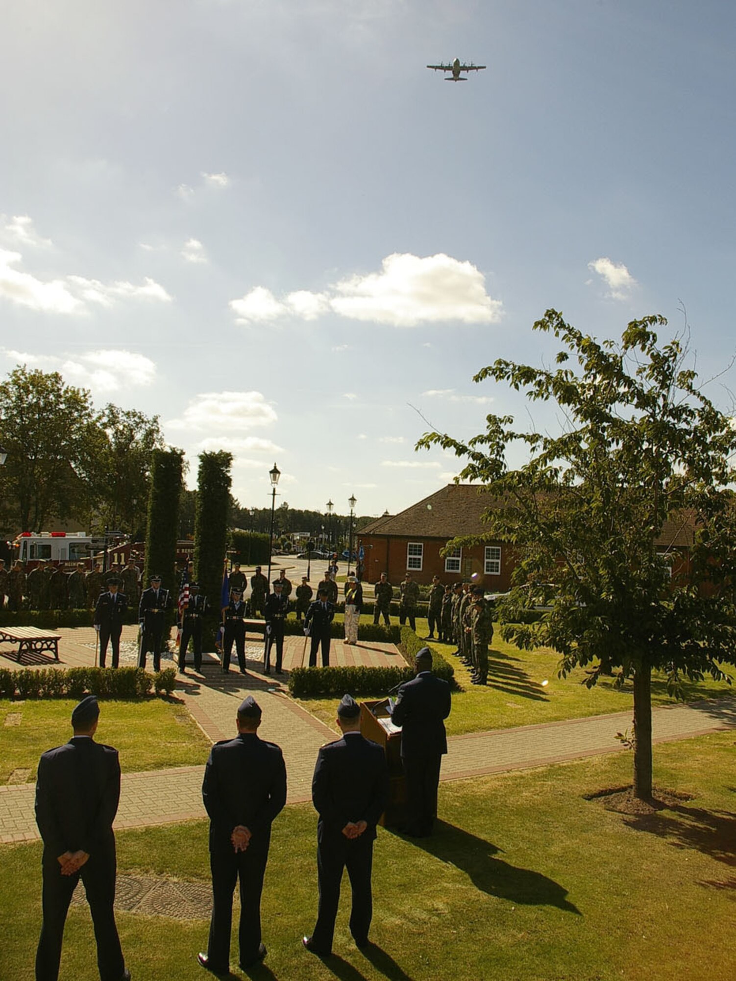A C-130 performs a fly-over during the memorial ceremony Sept. 11 at Remembrance Park. The ceremony was to remember the victims of the terrorist attacks who lost their lives in 2001. (U.S. Air Force photo by Karen Abeyasekere)