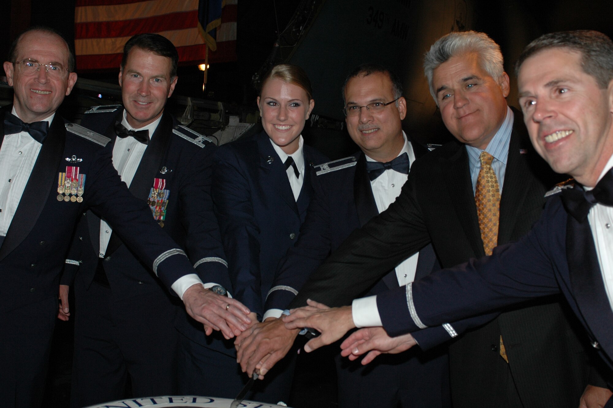 [left to right] Brig. Gen. Thomas Gisler, 349th Air Mobility Wing commander, Col. Steve Arquiette, 60th Air Mobility Wing commander, Airman Morgan Campbell, 60th Logistics Readiness Squadron, Col. Robert Lucania, 60th Medical Surgical Operations Squadron, Mr. Jay Leno, host of The Tonight Show, and Col. Richard McClain, 615th Contingency Response Wing vice commander, cut the Air Force 60th Anniversary cake Friday at Travis Air Force Base, Calif. In keeping with tradition, the most senior and the most junior time-in –service member cut the cake symbolizing the cooperation that exist between ranks.
(U.S. Air Force photo/Staff Sgt. Matthew McGovern)
