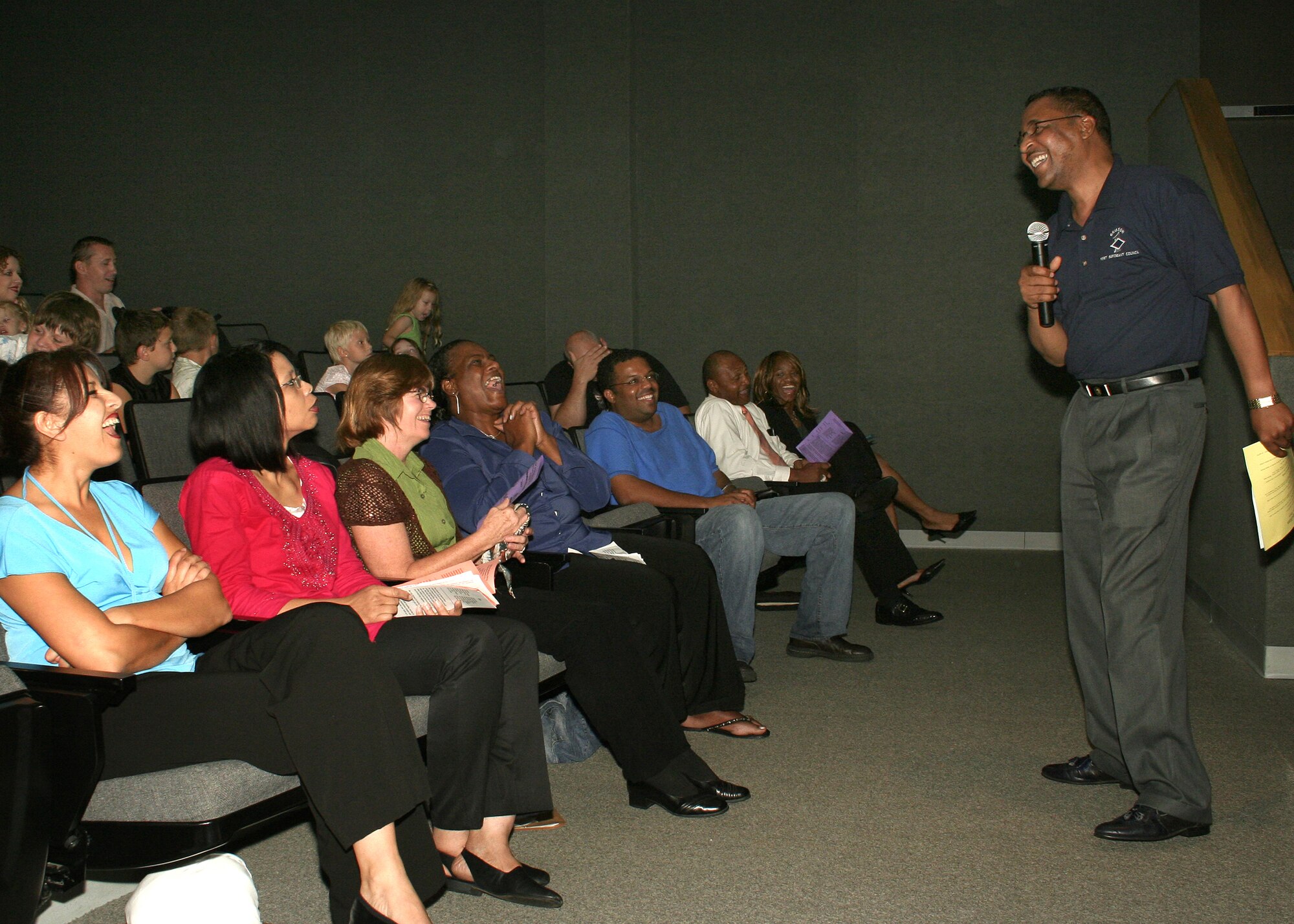 GRISSOM AIR RESERVE BASE, Ind., -- Master Sgt. Clifford Watson, 434th Civil Engineers Squadron first sergeant, gets a laugh from the crowd at the annual celebration of faith event held during the September unit training assembly. (U.S. Air Force photo/Tech. Sgt. Patrick Kuminecz)