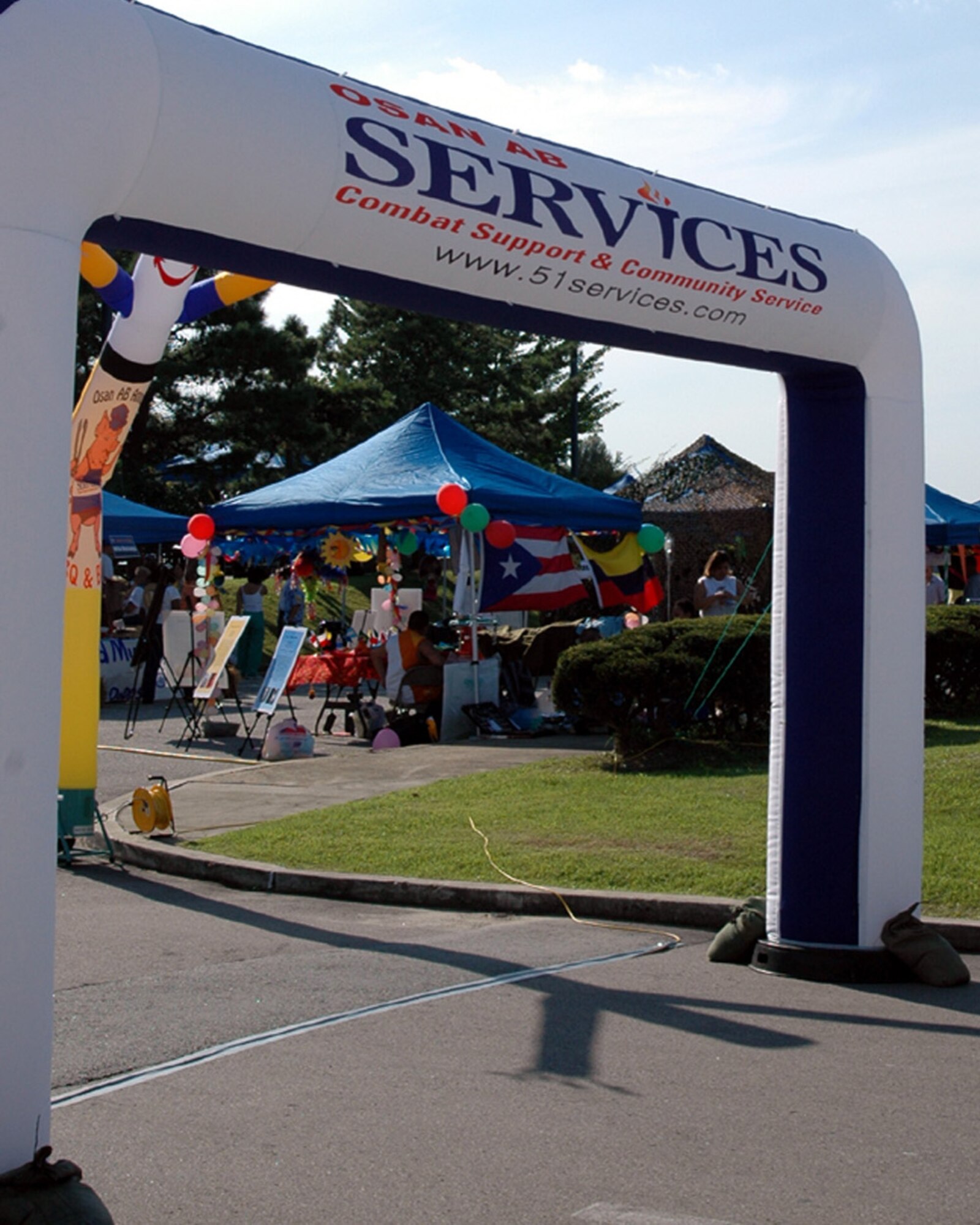 OSAN AIR BASE, Republic of Korea -- The parking lot of the Osan Officers' Club was transformed into a festival ground Sep. 10 for the sixth annual Barbecue and Blues.  (U.S. Air Force photo by Master Sgt. Steven Goetsch)
