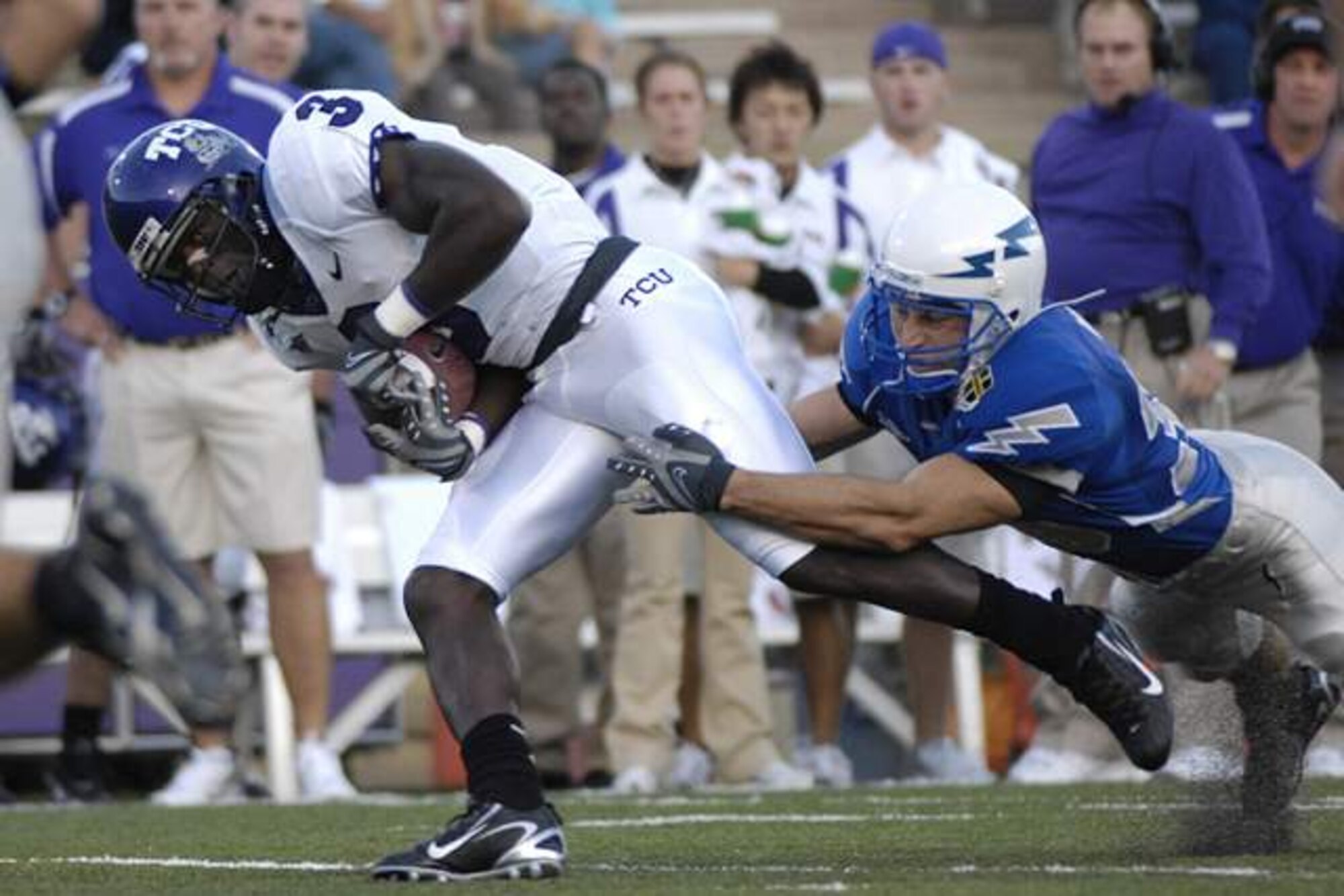 Air Force cornerback Garrett Rybak drags down TCU wide receiver Marcus Brock Sept. 13 at Falcon Stadium. Rybak made four solo tackles, assisted on four others plus forced and recovered a fumble in the bluesuiters 20-17 overtime win over the Horned Frogs. (U. S. Air Force photo/Dennis Rogers)         