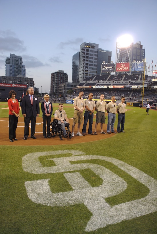 Standing alongside Fleet Week staff and an event sponsor representative, wounded warriors from Marine Medical Rehabilitation Platoon, Naval Medical Center San Diego received a standing ovation from thousands of baseball fans during the Padres game against the Pittsburgh Pirates Monday. The wounded warriors were honored on behalf of the entire military in accordance with one of this year?s Fleet Week celebrations.