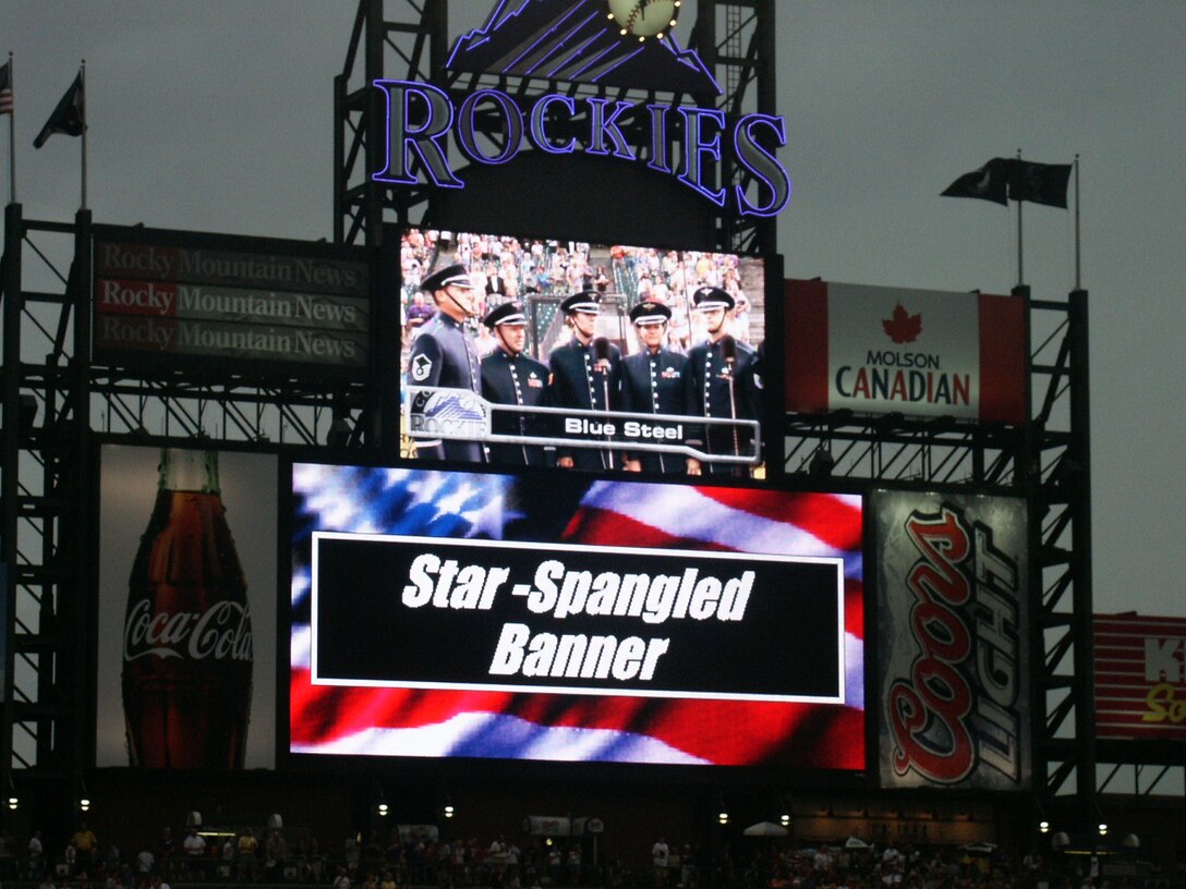 Members of Blue Steel singing the national anthem at a recent Colorado Rockies game. From left: SMSgt(c) James Bristow, SMSgt Scott Barbier, TSgt Victoria Cronsell, TSgt Julie Bradley, and TSgt Andrew Benton.