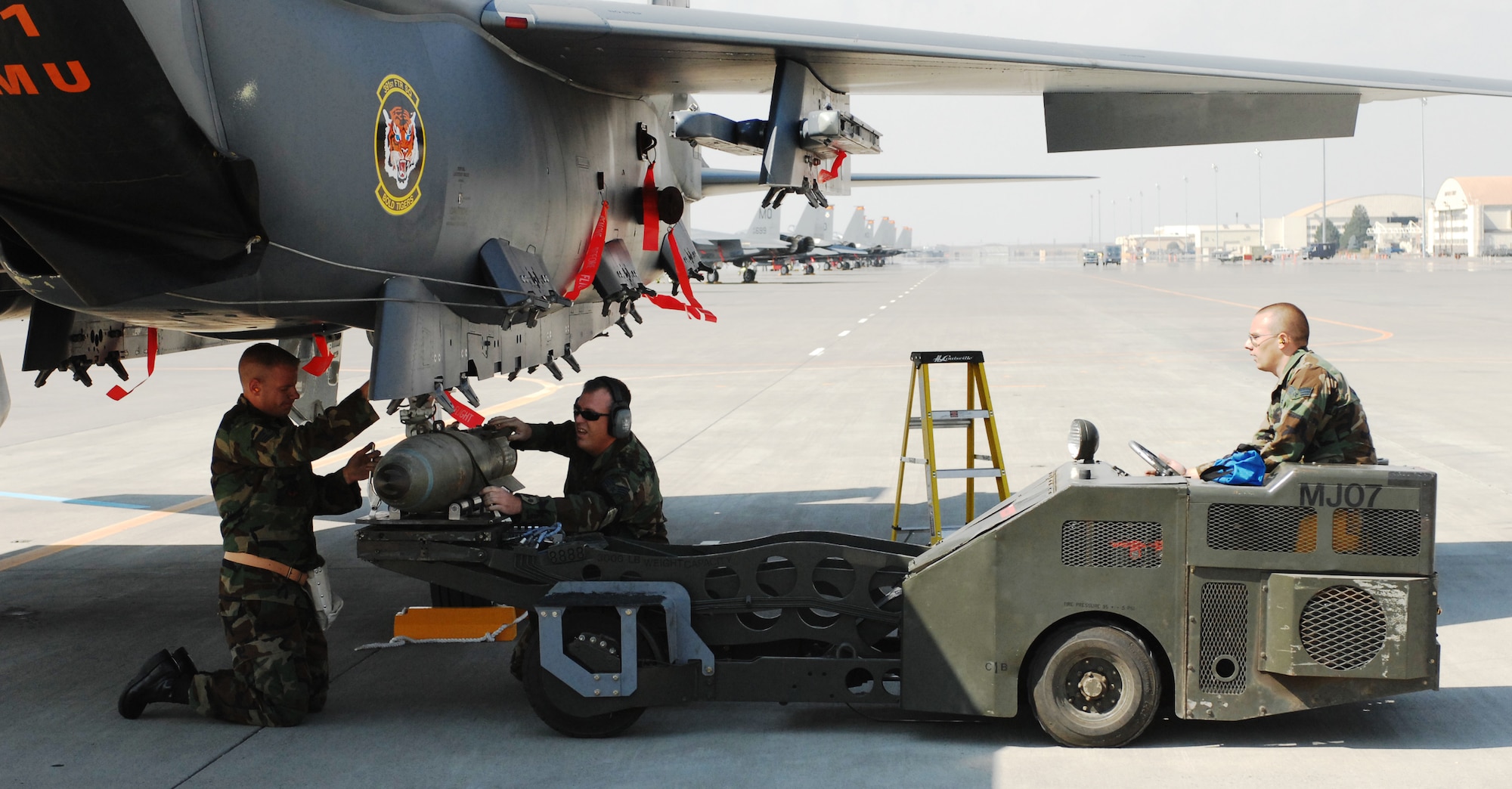 MOUNTAIN HOME AIR FORCE BASE, Idaho -- Base crew chiefs conduct a munitions-load demonstration during the 60th anniversary celebration here Sept. 14. Local community members joined Gunfighters to celebrate the Air Force’s heritage together from noon to 6 p.m. Events included the wing commander’s opening speech, a short demonstration with an A-10 Hercules and P-51 Mustang, military working dog demonstrations and the fire department’s wall of water demonstration. Squadron exhibits were also displayed throughout the day. (U.S. Air Force photo/Airman 1st Class Ryan Crane)