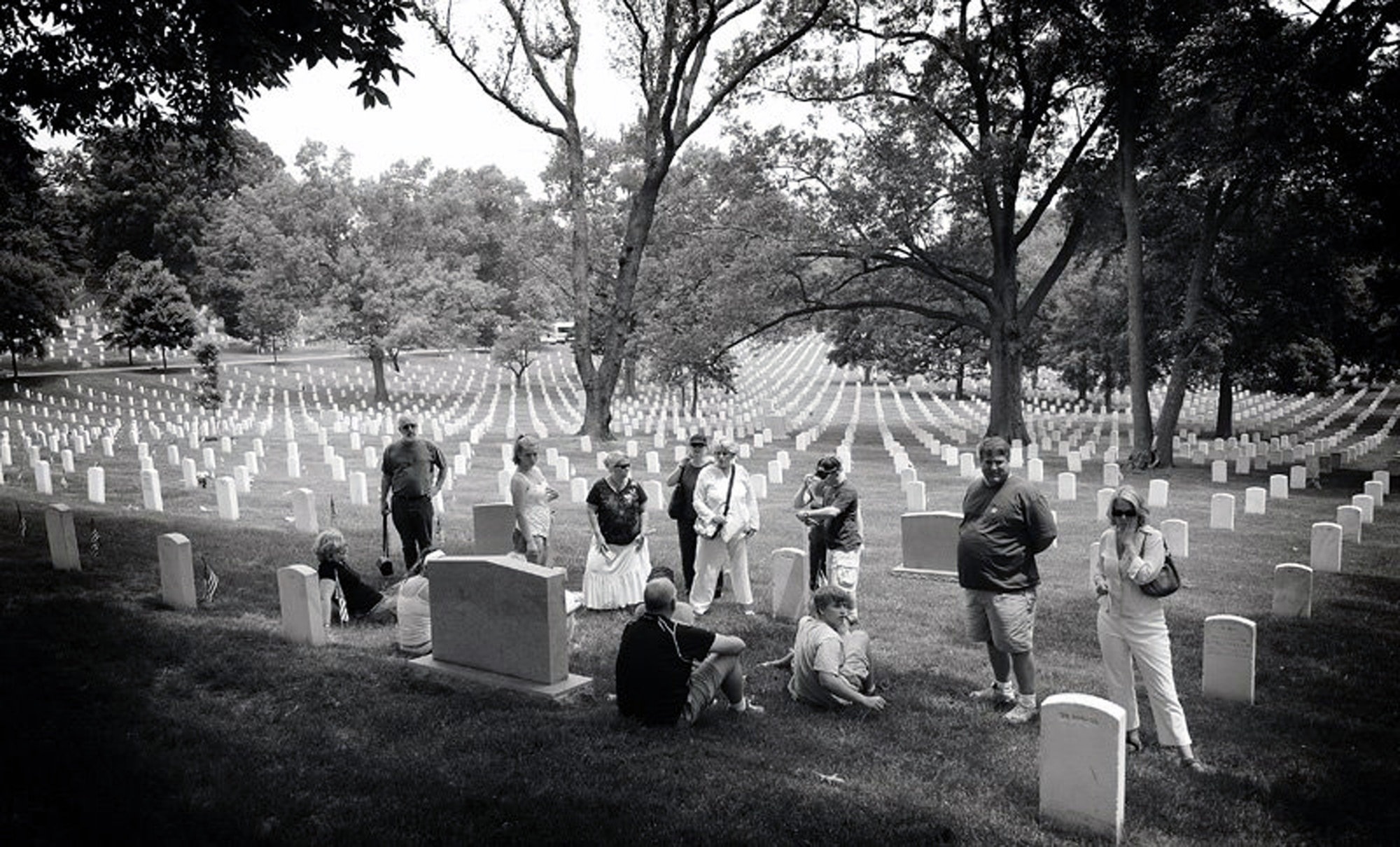 Familiy members of former Air Force 1st Lt. George Jones gather at the burial site for the lieutenant in Arlington National Cemetery in Washington May 28, 2007.  The family held a 10-year reunion of Lieutenant Jones being buried at Arlington and invited a special guest to join them -- Air Force Staff Sgt. Gary Ritter of the U.S. Air Force Expeditionary Center from Fort Dix, N.J.  Sergeant Ritter gave the daughter of Lieutenant Jones a POW/MIA bracelet he'd held on to for 19 years in hopes of one day giving it to the family. He did so on Memorial Day 2007.  (Photo by Christopher Duggan)