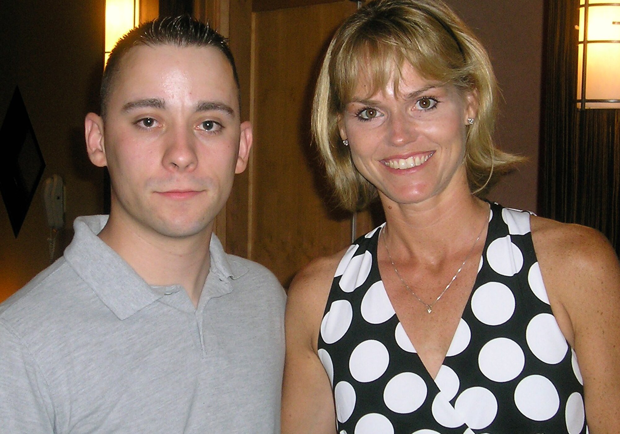 Staff Sgt. Gary Ritter, combat arms instructor for the U.S. Air Force Expeditionary Center at Fort Dix, N.J., stops for a photo with Kristine Galemmo, daughter of former Air Force 1st Lt. George E. Jones of Aberdeen, Miss., during a first-time meeting at a hotel in the Washington, D.C., area May 28, 2007.  Sergeant Ritter held on to a POW/MIA bracelet bearing Lieutenant Jones' name for 19 years and presented that bracelet to Kristine on Memorial Day 2007.  (Photo by Christopher Duggan)