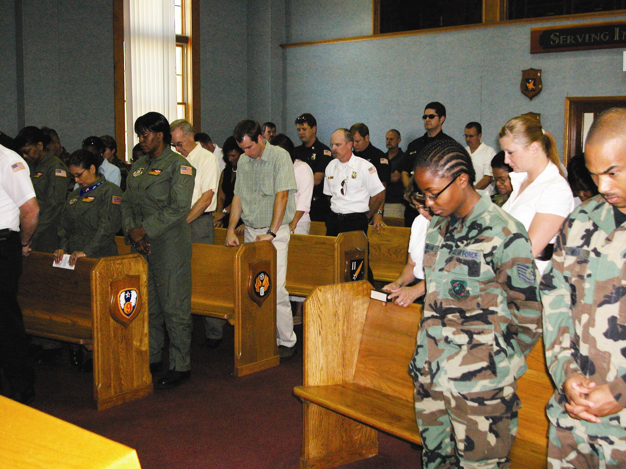 Troops, employees and friends of March Field bowed their heads in prayer during a service at the base chapel. The service was conducted by Chaplain (Lt. Col.) Francis Lowe.  (U.S. Air Force photo by LaGina Jackson)