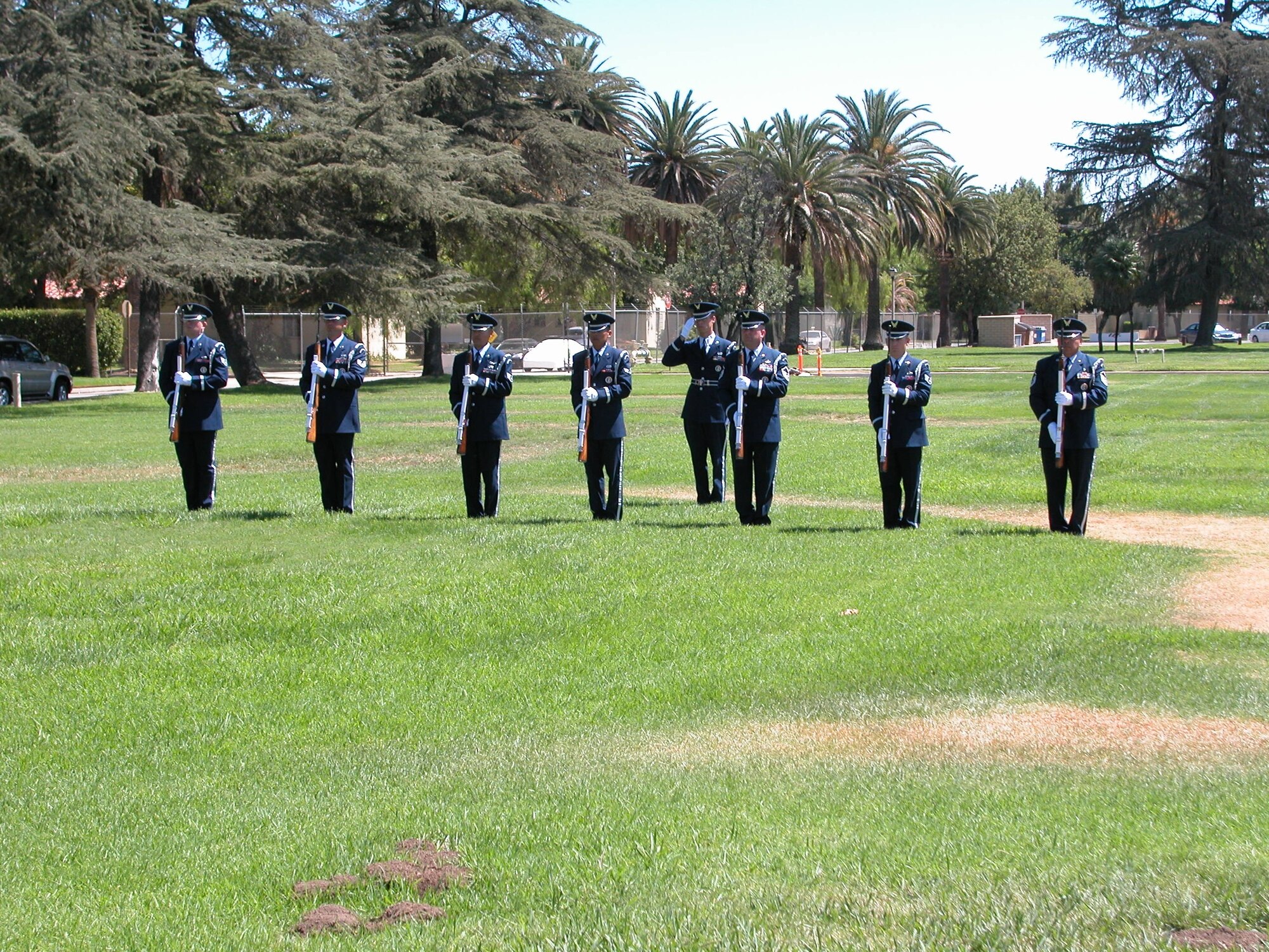 The 452nd Air Mobility Wing’s Honor Guard conducts a 21-gun salute for those who lost their lives six years ago.  (U.S. Air Force photo by LaGina Jackson)