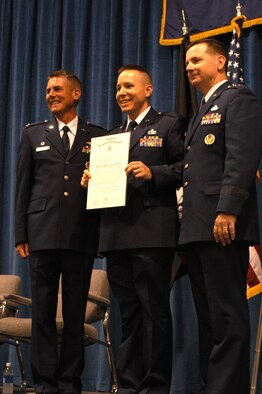 PITTSBURGH AIR RESERVE STATION, PA -- Officer candidate Robert K. Lytle, 32nd Aerial Port Squadron, receives commission as second lieutenant from Col. Michael Waggett and Maj. Gen. Tod M. Bunting.  2nd Lt. Lytle was one of twelve reservists in a class of 97 to complete the six-week officer commissioning program at McGhee Tyson Air National Guard Base, Tenn.  (AF photo by Master Sgt. Mark Winklosky)                          