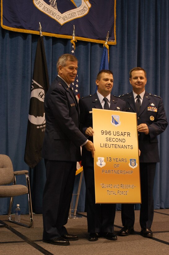 PITTSBURGH AIR RESERVE STATION, Pa. -- Brig. Gen. Richard Severson, Deputy Vice Commander of the Air Force Reserve Command and Maj. Gen. Tod M. Bunting, Adjutant General of Kansas and the guest speaker for the event, pin newly commissioned 2nd Lt. Shawn M. Walleck of the 911th Airlift Wing, Air Force Reserve Command, Pittsburgh, Pa.  Lt. Walleck was the 996th reservist to complete the six-week program at the Academy of Military Science, McGhee Tyson Air National Guard Base, Tenn.   This is the last class reservist will be attending AMS.  Beginning in Fiscal Year 2008, all reservists, along with active duty, will be going to a twelve-week Officer Training School at Maxwell Air Force Base, Ala. (AF photo by Master Sgt. Mark Winklosky)
                             