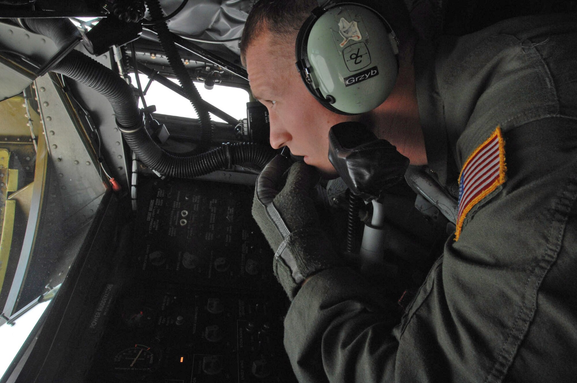 Staff Sgt. Mat Grzyb monitors an E-3 Sentry lining up to be refueled by a KC-135 Stratotanker Sept. 13 over Germany. The KC-135 is from the Wisconsin Air National Guard at Gen. Mitchell International Airport in Milwaukee. The plane can deliver about 1,000 gallons of fuel per minute, carry up to 200,000 pounds of fuel, 83,000 pounds of cargo and provide air refueling to all branches of service and our allies. Sergeant Grzyb is a boom operator assigned to the 126th Air Refueling Squadron. (U.S. Air Force photo/Senior Airman Josie Kemp) 
