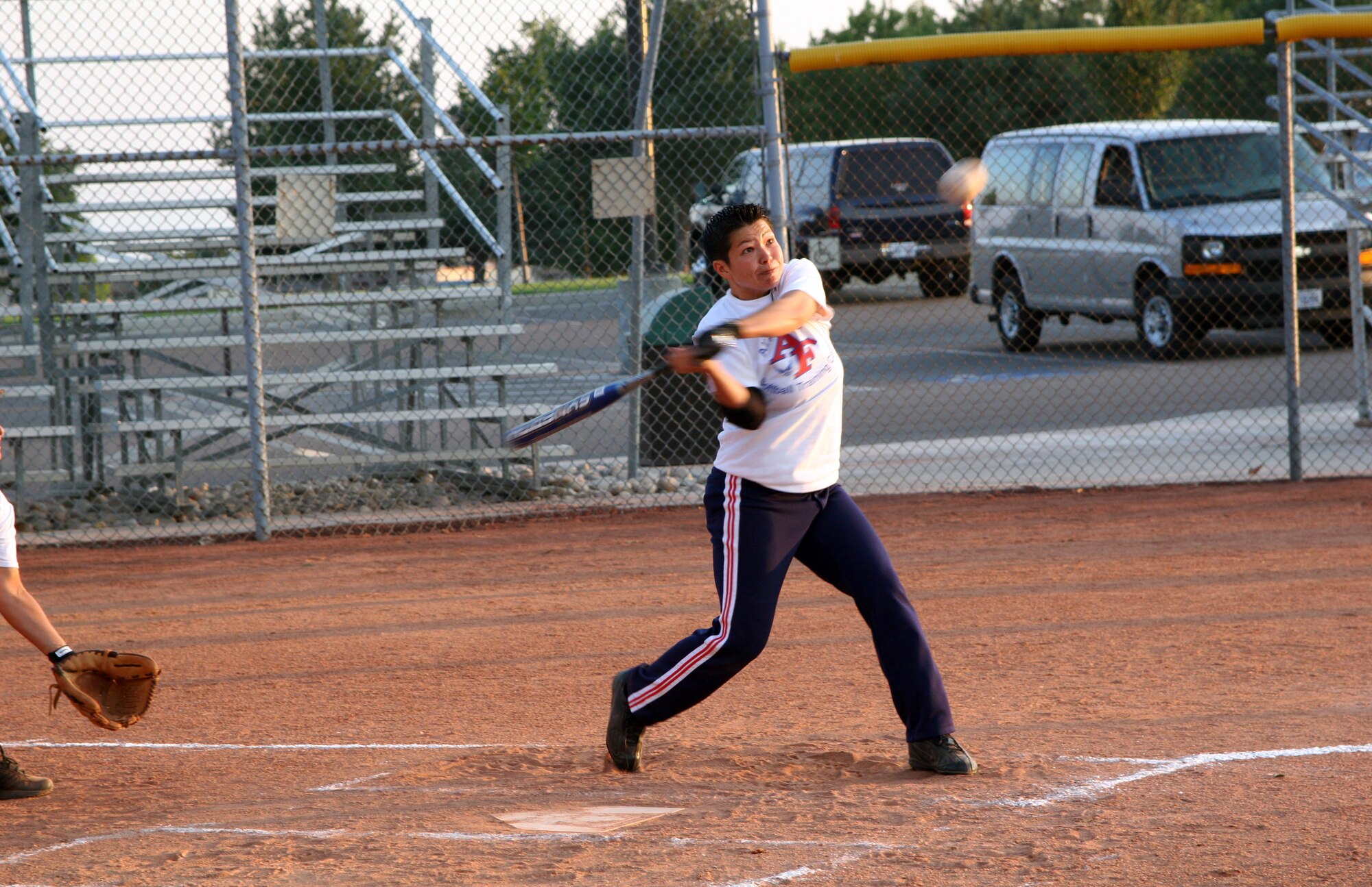 Staff Sgt. Darleen Rayburn takes a swing during tryouts for the 2007 All-Armed Forces Women's Softball Championship to be held Sept. 18 to 20 at Hill Air Force Base, Utah. Sergeant Rayburn is stationed at Kadena Air Base, Japan. (U.S. Air Force photo/1st Lt. Amber Balken) 