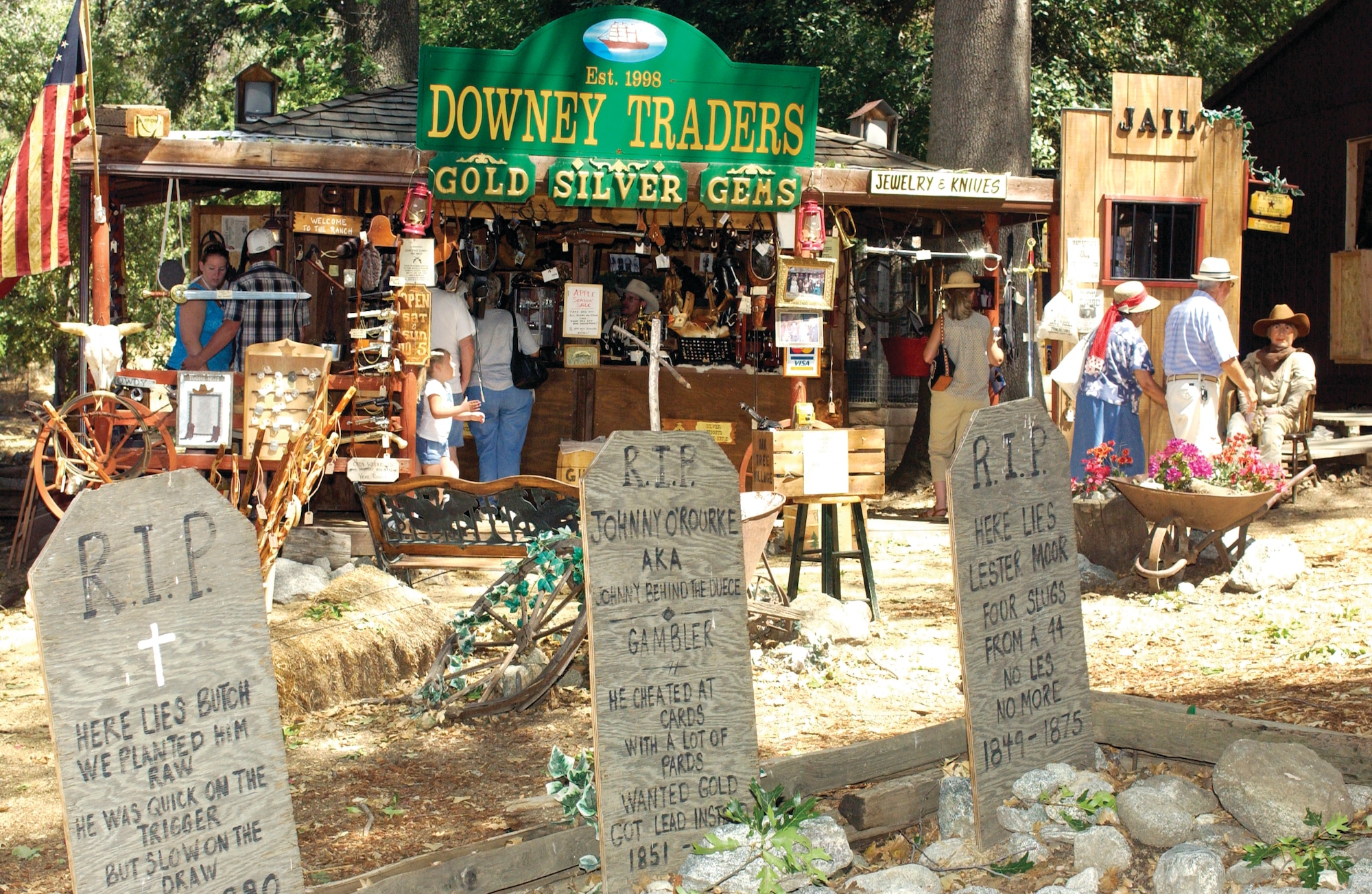 Three fictional gravestones sit in front of the Downey Traders and Mining Company, a
western themed store co-owned by Sergeant Higginson. The Village is in Oak Glen, Calif., approximately 30 miles northeast of March Air Reserve Base. (U.S. Air Force photo by Amy Abbott)