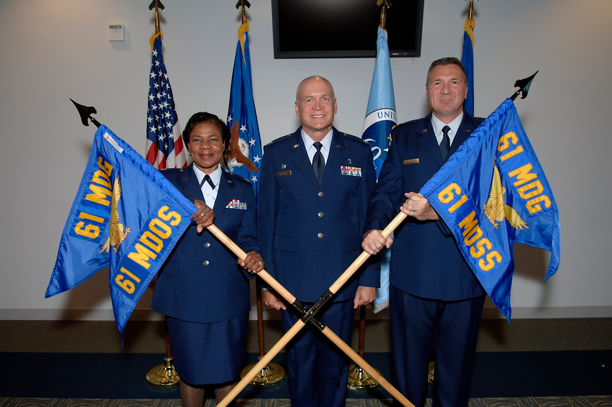 The 61st Medical Operations Squadron and the 61st Medical Support Squadron became the two newest medical squadrons at Los Angeles Air Force Base during an activation ceremony held in the Gordon Conference Center, Sept. 12.  Pcitured from left to right are Lt. Col. Bernadette Anderson, 61st Medical Operations Squadron commander; Col. Brian Deckert,  61st Medical Group commander; and Lt. Col. K. David Huth , 61st Medical Support Squadron commander.