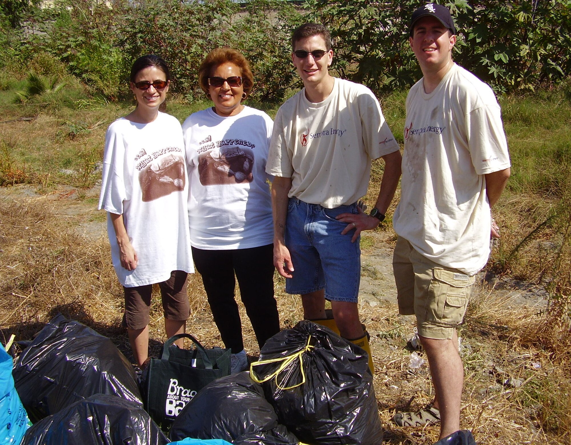 Volunteers from SMC joined with other companies and community groups in a recent Coastal Cleanup Day organized by Heal the Bay and sponsored by Southern California Gas Company.  Pictured at the Compton Creek cleanup site are (l-r); Maj. Cecilia Brawner, Compton Council Member Yvonne Arceneaux, TSgt. Mike McGeever, and Maj. Sean Rucker. Two-hundred volunteers picked up six dump truck loads of trash.
