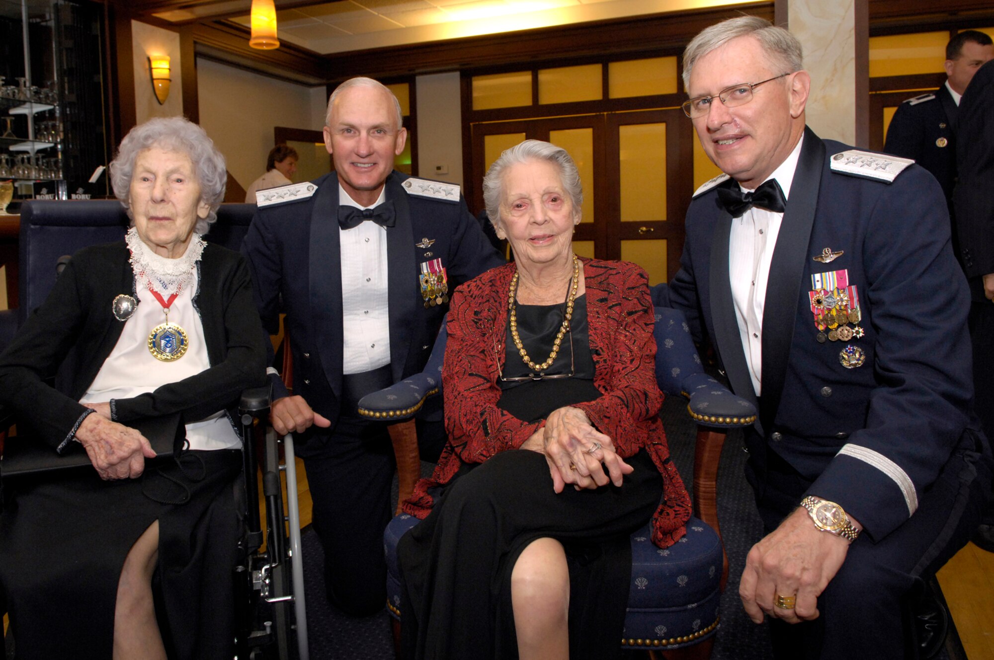 From left, Chief Master Sgt. Esther MacKay, the oldest living chief master sergeant, Electronic Systems Center Commander Lt. Gen. Chuck Johnson, Women’s Airforce Service Pilot June Braun Bent, and  Lt. Gen. Roger A. Brady, Air Force Deputy Chief of Staff for Personnel, Headquarters U.S. Air Force, visit with each other during the Air Force’s 60th Anniversary Ball Friday.  General Brady was the guest speaker for the evening. (U.S. Air Force photo by Mark Wyatt.)