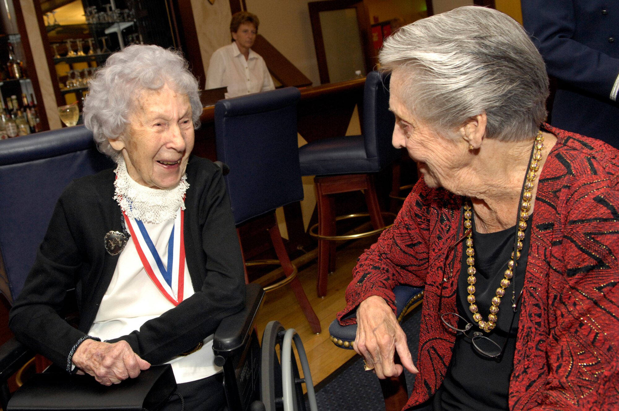 From left, Chief Master Sgt. Esther MacKay, the oldest living chief master sergeant, reminisces with Women’s Airforce Service Pilot June Braun Bent, who served from October 1943 to Dec. 20, 1944. Chief MacKay and Ms. Bent were distinguished visitors at the Air Force’s 60th Anniversary Ball held Friday. (U.S. Air Force photo by Mark Wyatt.)