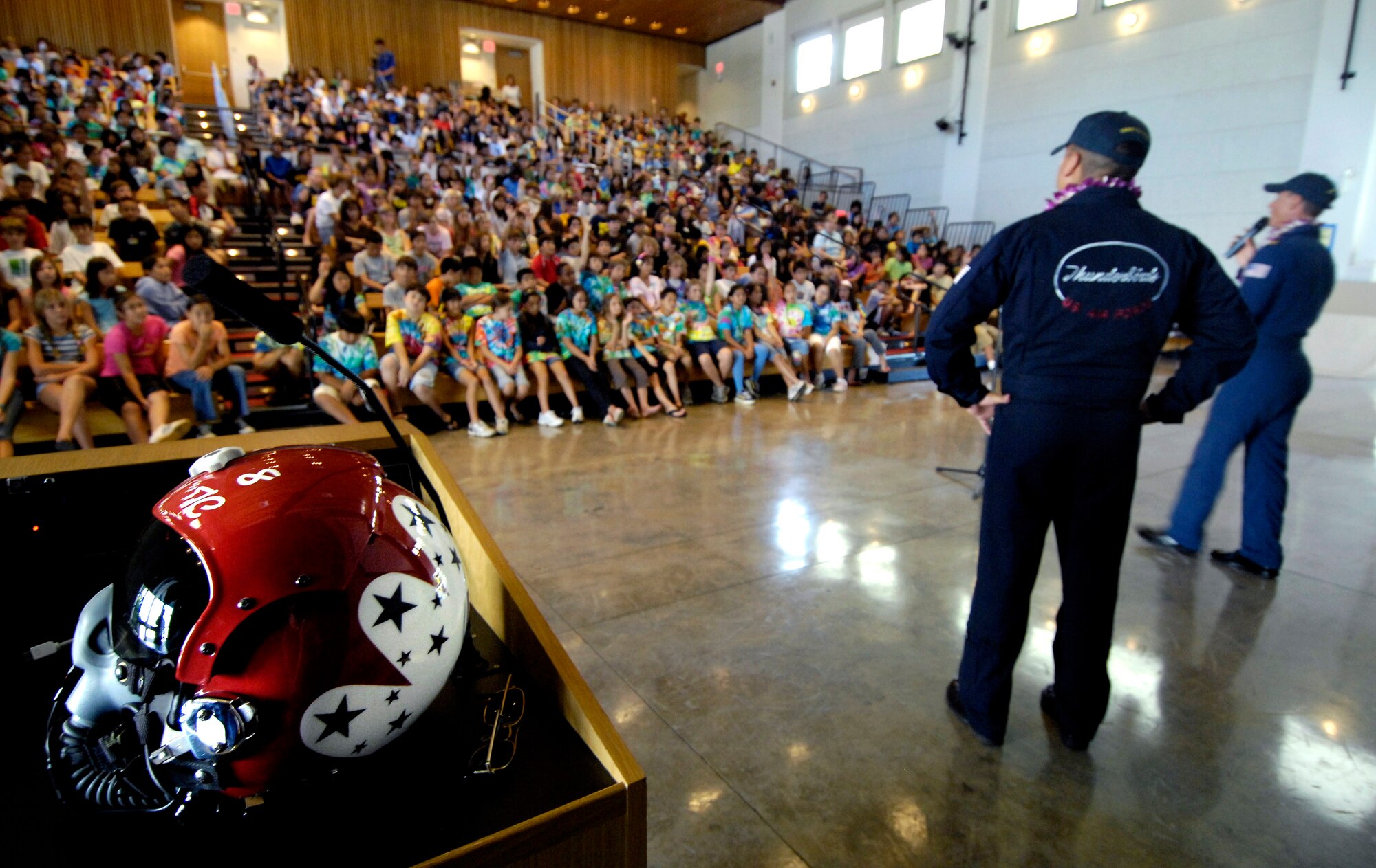 Tech. Sgt. Mario Munguia and Maj. Tad Clark talk about equipment they use as members of the Air Force Deomonstation Team, the Thunderbirds, to middle school children Sept. 14 at the Punahou School in Honolulu. The Thunderbirds made a community appearance at the school in Oahu as part of Air Force Week Honolulu. (U.S. Air Force photo/Tech. Sgt. Shane A. Cuomo) 