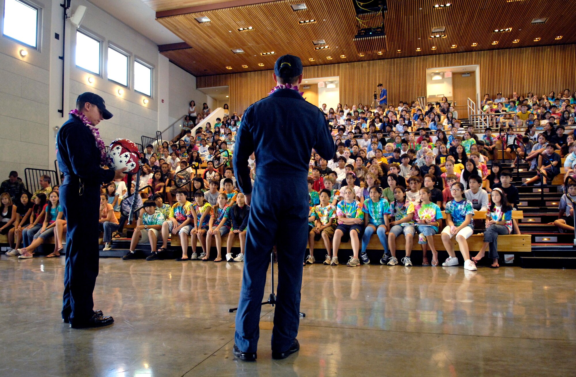 Tech. Sgt. Mario Munguia and Maj. Tad Clark talk about equipment they use as members of the Air Force Deomonstation Team, the Thunderbirds, to middle school children Sept. 14 at the Punahou School in Honolulu. The Thunderbirds made a community appearance at a school in Oahu as part of Air Force Week Honolulu. (U.S. Air Force photo/Tech. Sgt. Shane A. Cuomo) 