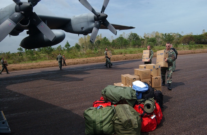 PUERTO CABEZAS, Nicaragua – Soldiers and Airman offload supplies from C-130 Sept. 14.  The C-130, assigned to the 908th Airlift Wing at Maxwell Air Force Base, Ala., delivered a P-19 fire truck and firefighters from Soto Cano Air Base, Honduras, to support hurricane relief operations here.  (U.S. Air Force photo by Tech. Sgt. Sonny Cohrs)