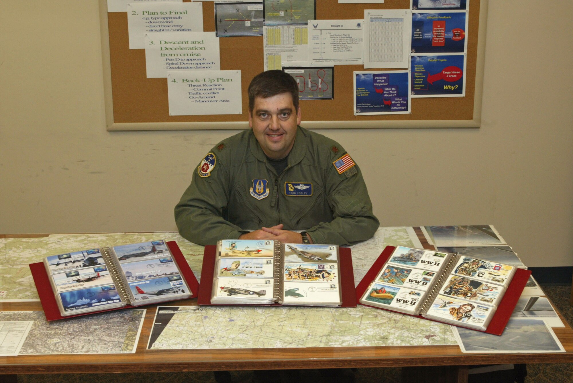 Maj. Todd Copley proudly displays his extensive collection of cancelled stamps. Major Copley is with the 700th Airlift Squadron, Dobbins Air Reserve Base, GA. (U.S. Air Force photo/Donald Peek)
