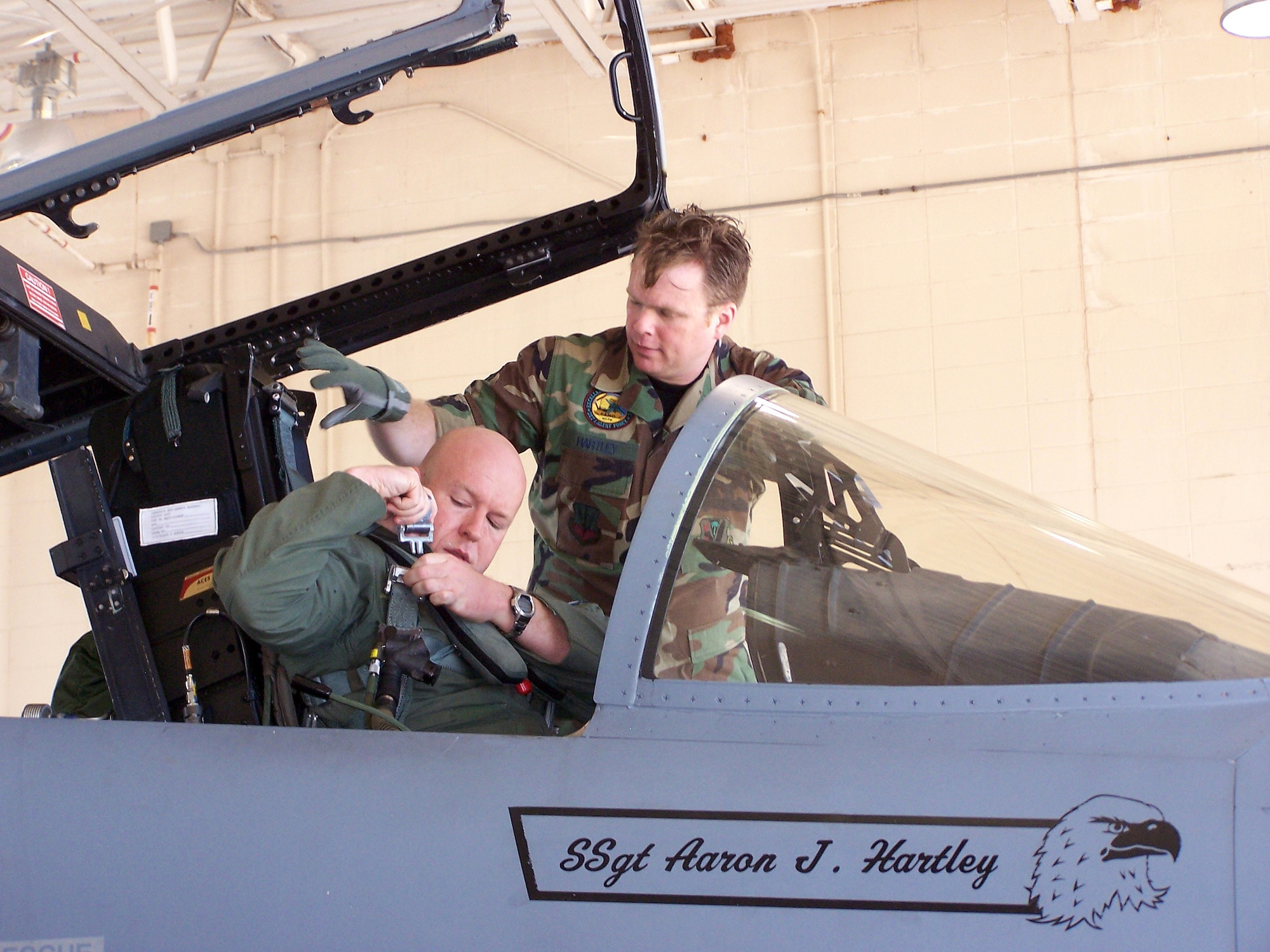 Capt. Todd Pearson, 390th Fighter Squadron pilot from Mountain Home Air Force Base, Idaho, is assisted by Staff Sgt. Aaron Hartley, a Florida Air National Guard 125th Fighter Wing, Detachment 1, crew chief during the Celestial Eagle Remembrance Flight at Homestead Air Reserve Base, Fla. Captain Pearson’s father, retired Maj. Gen. Doug Pearson, flew the exact same F-15, now assigned to the 125th FW, exactly 22 years prior while accomplishing the only successful satellite kill by an aircraft launched missile in history. Sergeant Hartley came up with the idea while researching the history of the F-15s assigned to the 125th FW. (U.S. Air Force photo/Senior Airman Erik Hofmeyer)