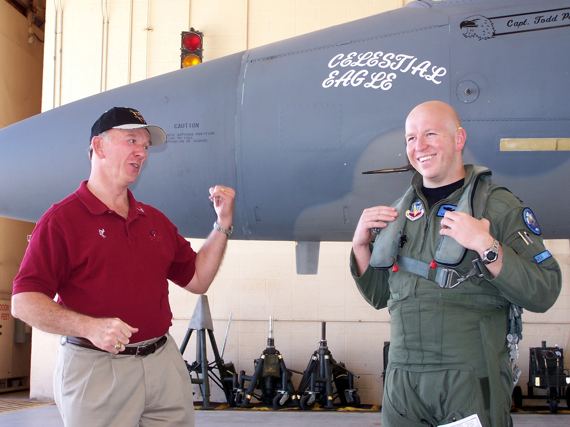 Retired Maj. Gen. Doug Pearson (left) and Capt. Todd Pearson (right), 390th Fighter Squadron pilot from Mountain Home Air Force Base, Idaho, joke around before Captain Pearson took off on the Celestial Eagle remembrance flight Sept. 13 at Homestead Air Reserve Base. General Pearson flew the exact same F-15, now assigned to the Florida Air National Guard 125th Fighter Wing, exactly 22 years prior while accomplishing the only successful satellite kill by an aircraft launched missile in history. (U.S. Air Force photo/Senior Airman Erik Hofmeyer)