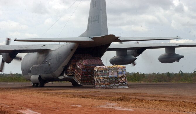 PUERTO CABEZAS, Nicaragua - A Marine Corps KC-130 offloads six pallets of beds donated by El Salvador in Puerto Cabezas, Nicaragua, Sept. 16.  The Marine KC-130 is part of U.S. relief efforts in Nicaragua in the wake of Hurricane Felix.  The U.S. State Department and Department of Defense are working together to bring food, water and other needed items to small communities on the Nicaraguan coast that were affected by the hurricane.  (Air Force photo by 1st Lt. Erika Yepsen)