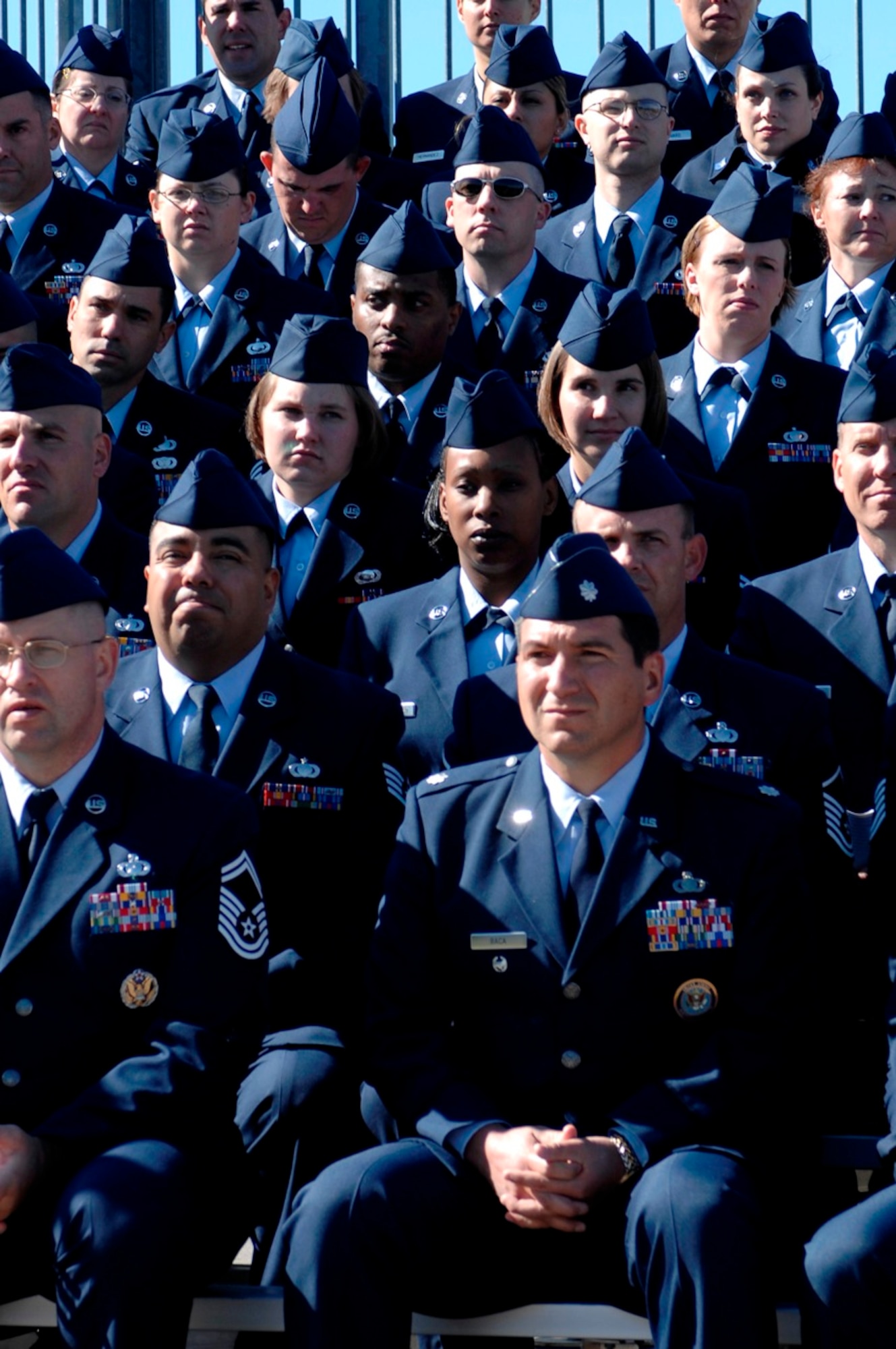 The staff of the Air Force Financial Services Center observe as Secretary of the Air Force Michael Wynne hands the AFFSC guidon to Col. Judy Perry, AFFSC commander, during her assumption of command ceremony Sept 14. (U.S. Air Force photo/Staff Sgt. Michael Keller)