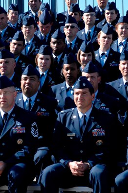 The staff of the Air Force Financial Services Center observe as Secretary of the Air Force Michael Wynne hands the AFFSC guidon to Col. Judy Perry, AFFSC commander, during her assumption of command ceremony Sept 14. (U.S. Air Force photo/Staff Sgt. Michael Keller)