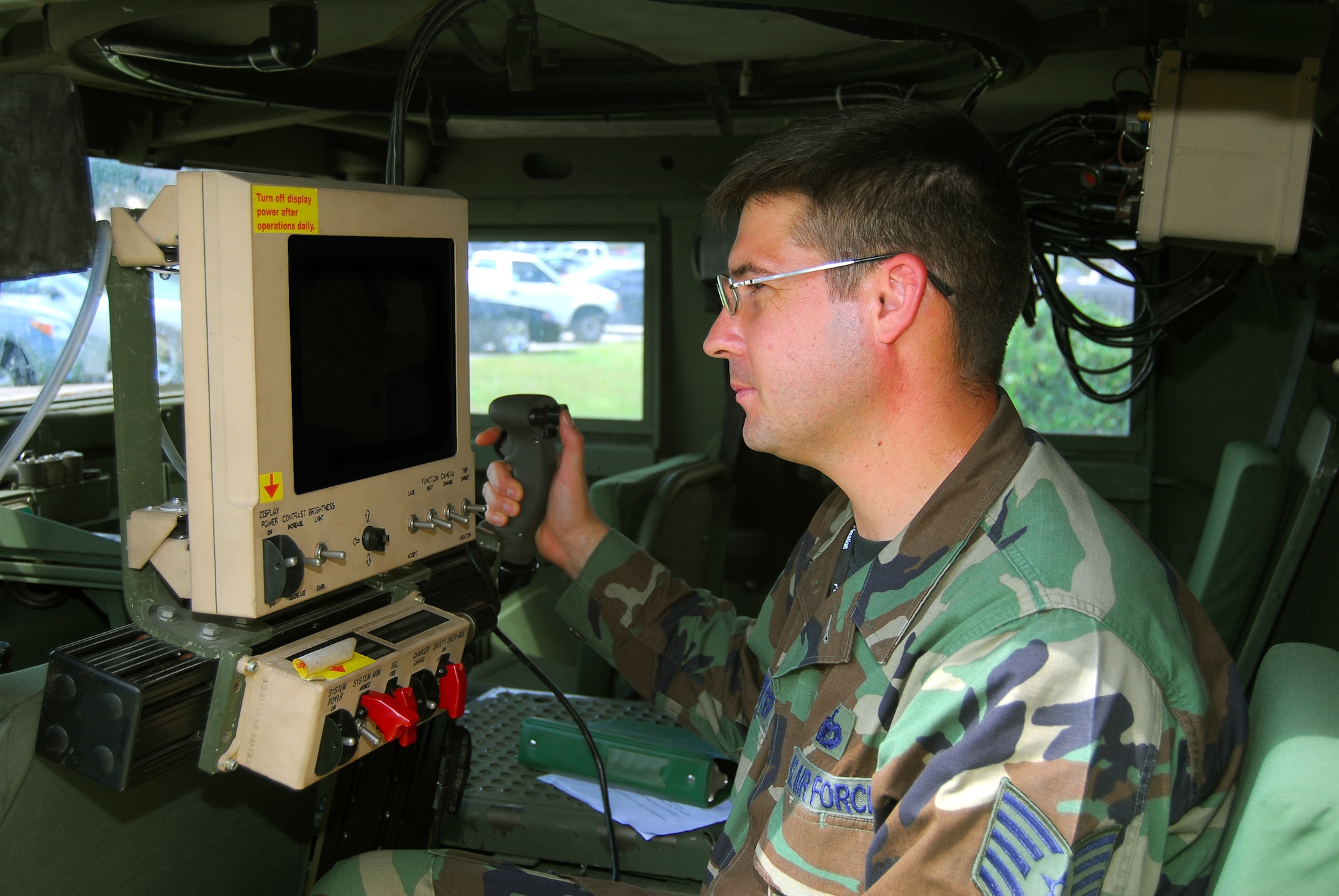 Tech. Sgt. Mark Klinefelter, 824th Security Forces Squadron, Alpha flight sergeant, operates a common remotely operated weapon station Sept. 12 at Moody Air Force Base. The CROWS turret allows a gunner to remain safely protected inside his armored vehicle while operating the computer-stabilized, laser-aimed weapon.  (U.S. Air Force photo by Tech. Sgt. Parker Gyokeres)