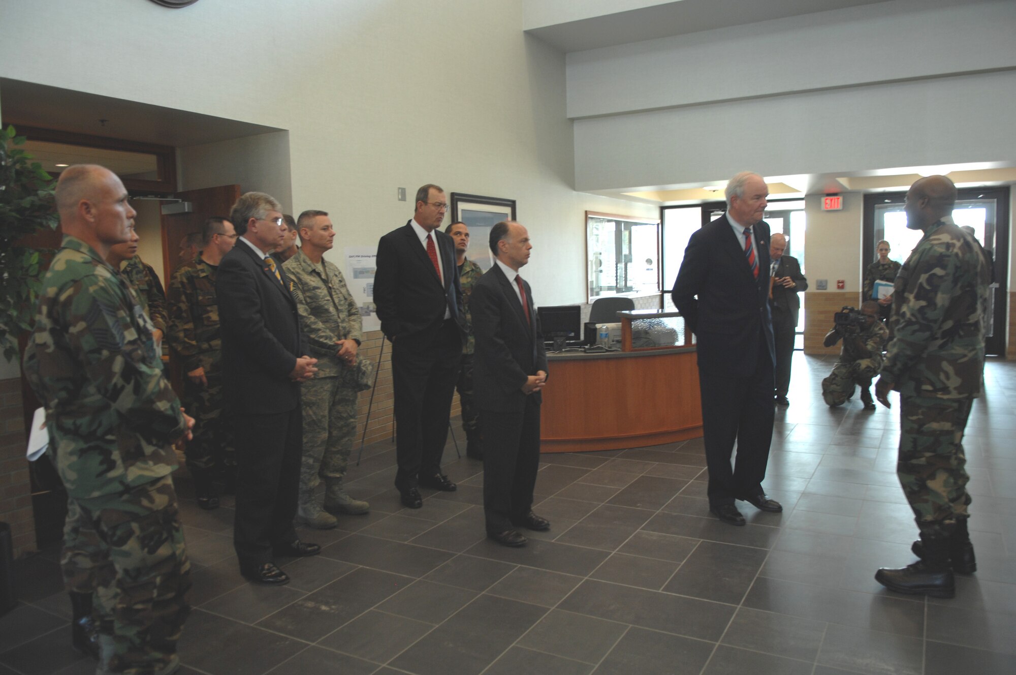 Secretary of the Air Force Michael Wynne and, center, John Vonglis, Principal Deputy Assistant Secretary of the Air Force for Financial Management are briefed on the new Air Force Financial Services Center operations. The center, which is located at Ellsworth Air Force Base, opens its doors to customer with a grand opening celebration, part of which included an assumption of command ceremony for Col. Judy Perry. Colonel Perry is the AFFSC’s first commander. (US Air Force photo by Airman 1st Class Anthony Sanchelli)