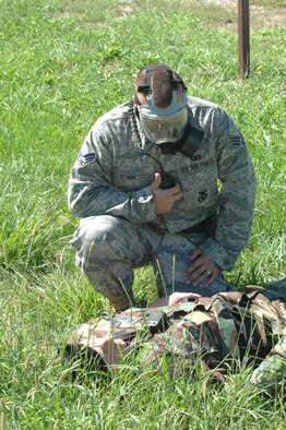 WHITEMAN AIR FORCE BASE, Mo. -- Senior Airman Derin Stark, 509th Security Forces Squadron, checks on Staff Sgt. Justin Schwartz, 509th SFS, at Ike Skelton Park Sept 12. Sergeant Schwartz was affected by a chemical attack during exercise Guardian Lite. (U.S. Air Force photo/Airman First Class Cory Todd)