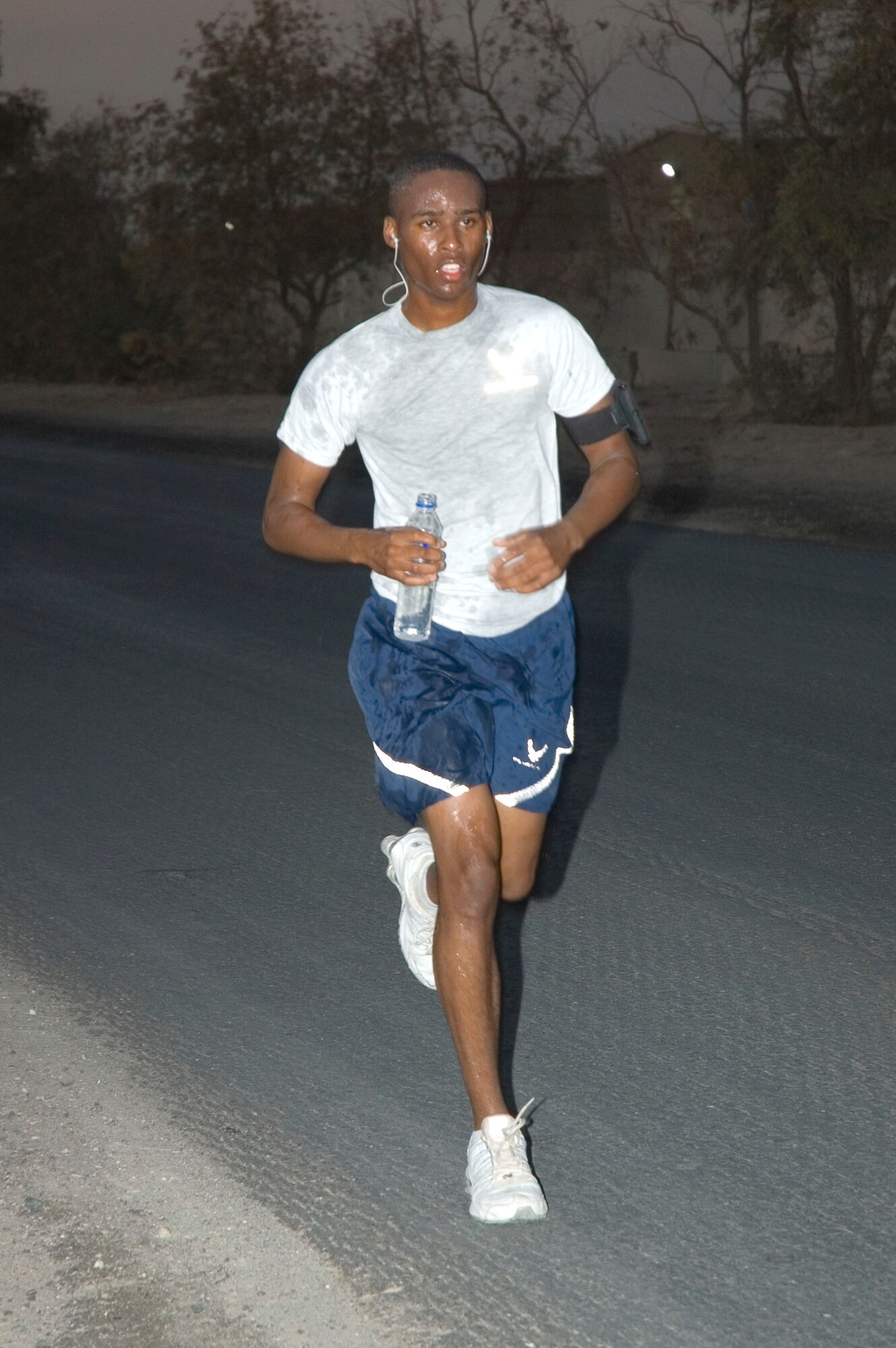 An Airman with the 386th Air Expedtionary Wing participates in a half marathon here Sept. 15. The 386th Expeditionary Services Squadron hosted the event to support the Annual Air Force Marathon which also took place on the same day.  (U.S. Air Force photo Staff Sgt. Tia Schroeder) 
